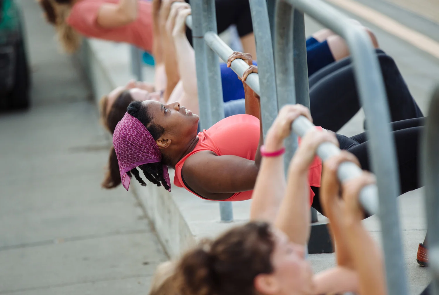 Doing pull ups during Boot Camp workout at Jack London Square in Oakland, Calif.