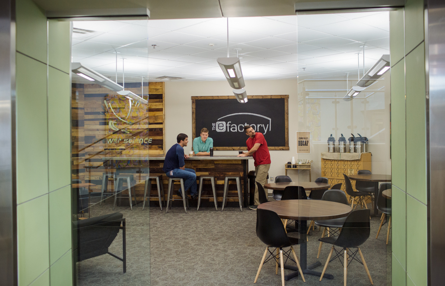 A meeting of the minds in the eFactory lounge. Free coffee on the right. 