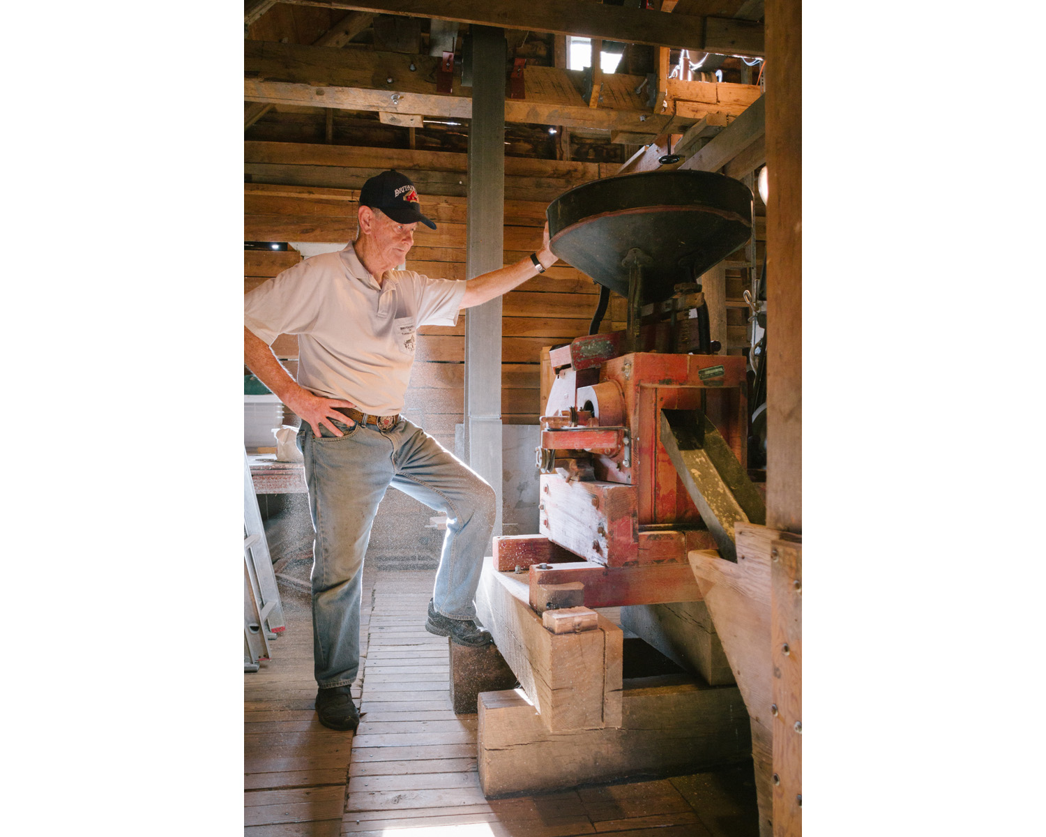 Corn meal dust emerges from the milling stones while they are operating at Turnback Creek near Halltown, Mo. on Aug. 13, 2015. Photos by Brad Zweerink