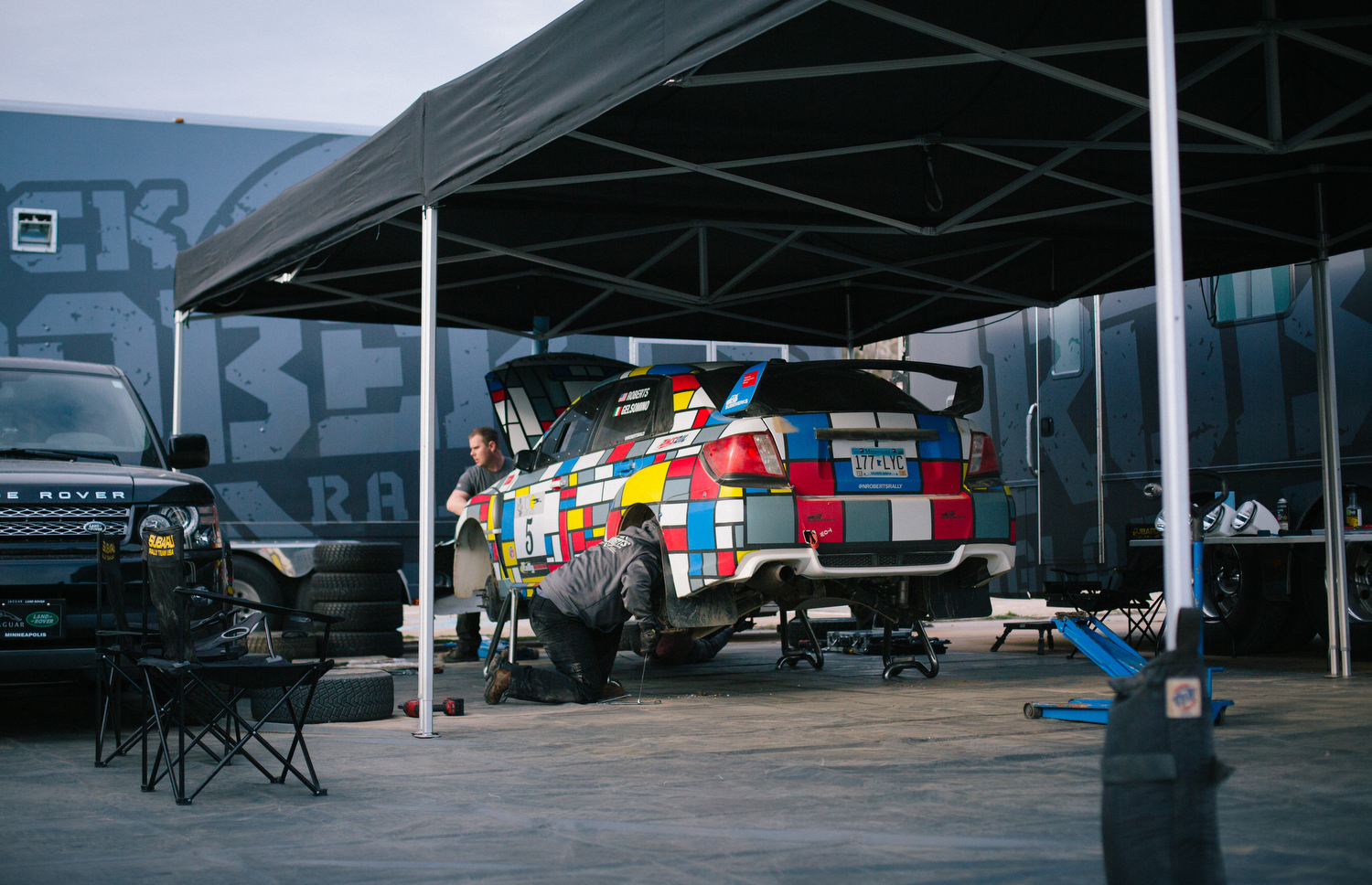 Crews work on Nick Roberts' 2013 Subaru Impreza WRX STi. 