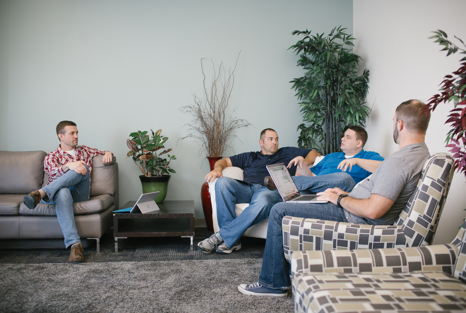 Brad Hinman, Michael Cory, Andrew Jordan, and Greg Sutton, left to right, talk during a weekly project meeting at PILR TECH's office in Joplin, Mo. on Sept. 27, 2016. Photo by Brad Zweerink