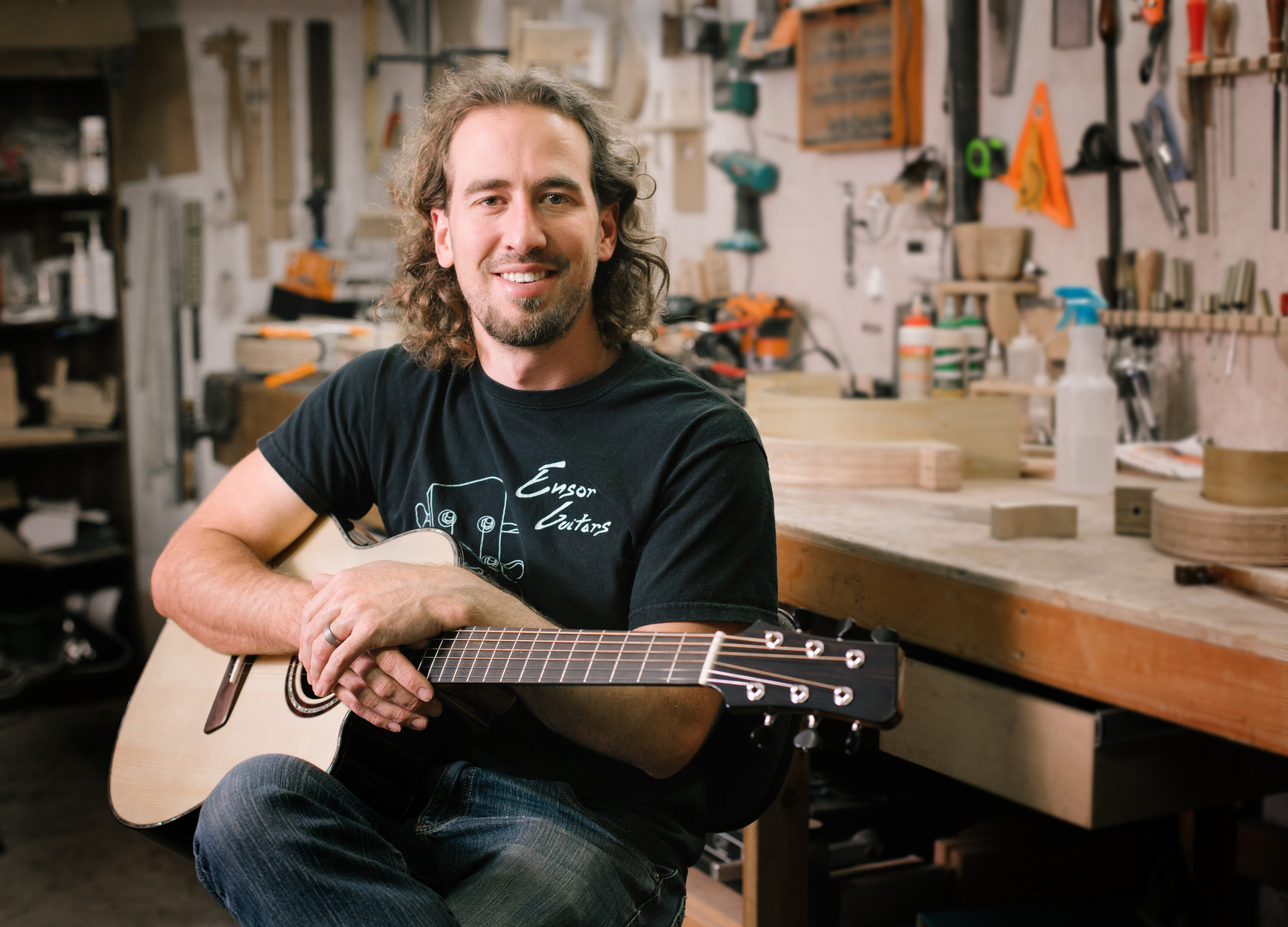 Chris Ensor, holding one of his Ensor Standard guitars made from Brazilian rosewood, Adirondack spruce, ebony and mahogany.