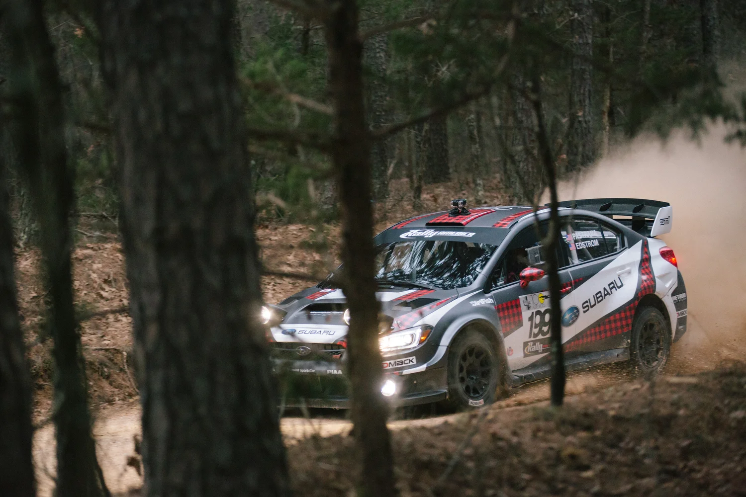  Subaru Rally Team USA driver Travis Pastrana and co-driver Christian Edstrom race down a dirt road on stage six. 