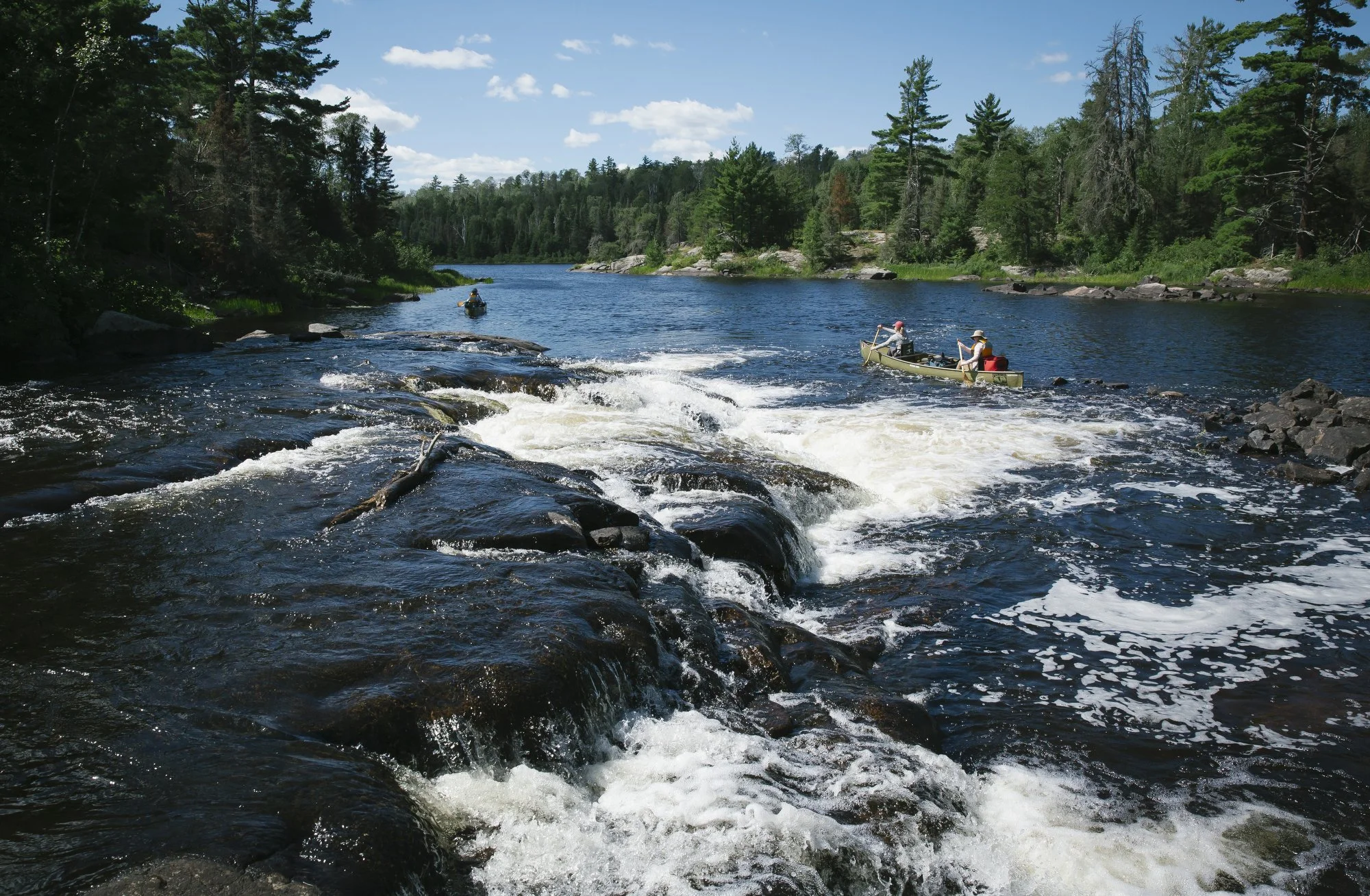  A mine proposal in the Boundary Waters Canoe Area Wilderness in northern Minnesota threatens to ruin a priceless wilderness and a town’s plans to thrive. Read more  about the issue here .     Canoers paddle in the wilderness area.  