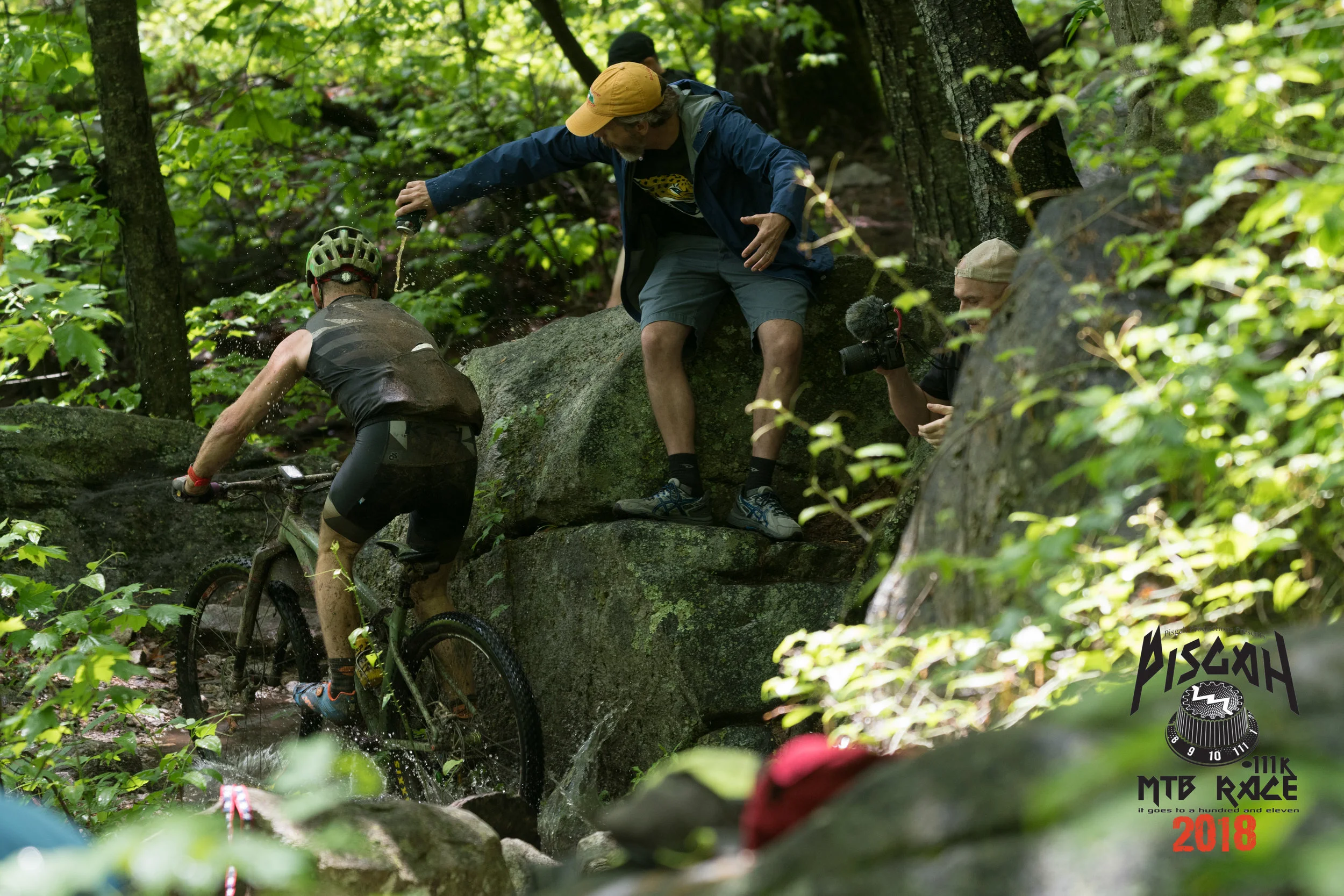 Josh Kunz of Knobby Side Down (3rd place Single Speed) is drenched with beer by Pilot Rock Hecklers. Photo credit: Asheville Icon Media, Steve Barker