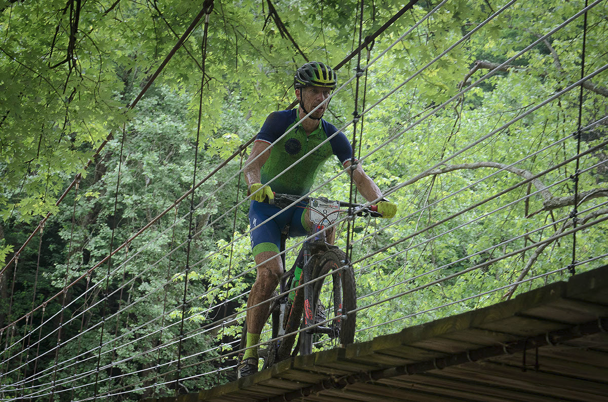 2017 MTB Nats M45-49 winner Brian Schworm crosses the hanging bridge Photo Credit: Butch Phillips