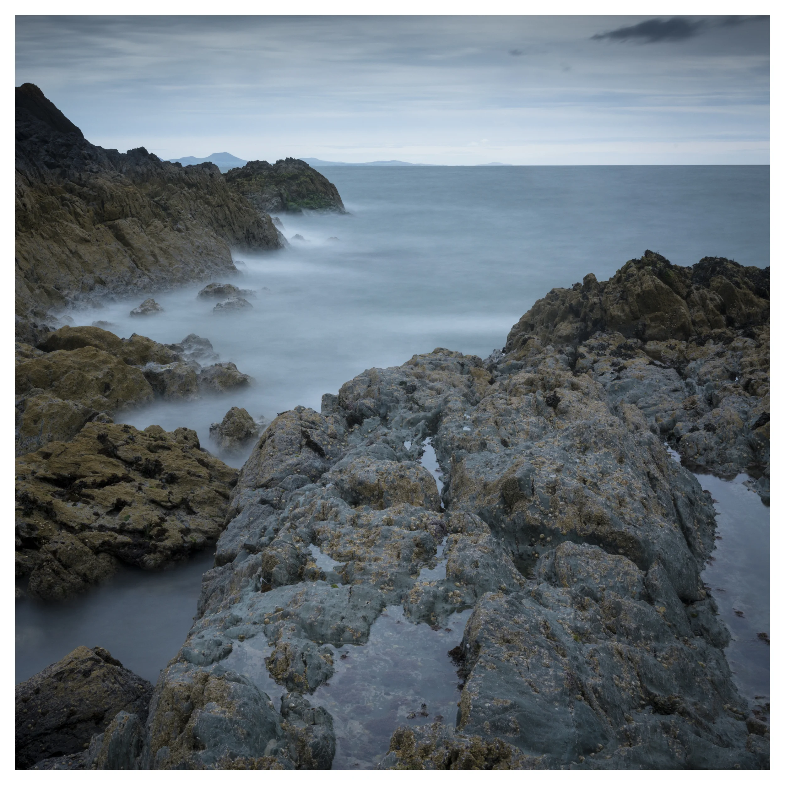Taken looking out South West towards the Llyn Peninsula. Taken using a long exposure with the Lee big stopper to get the misty water effect.