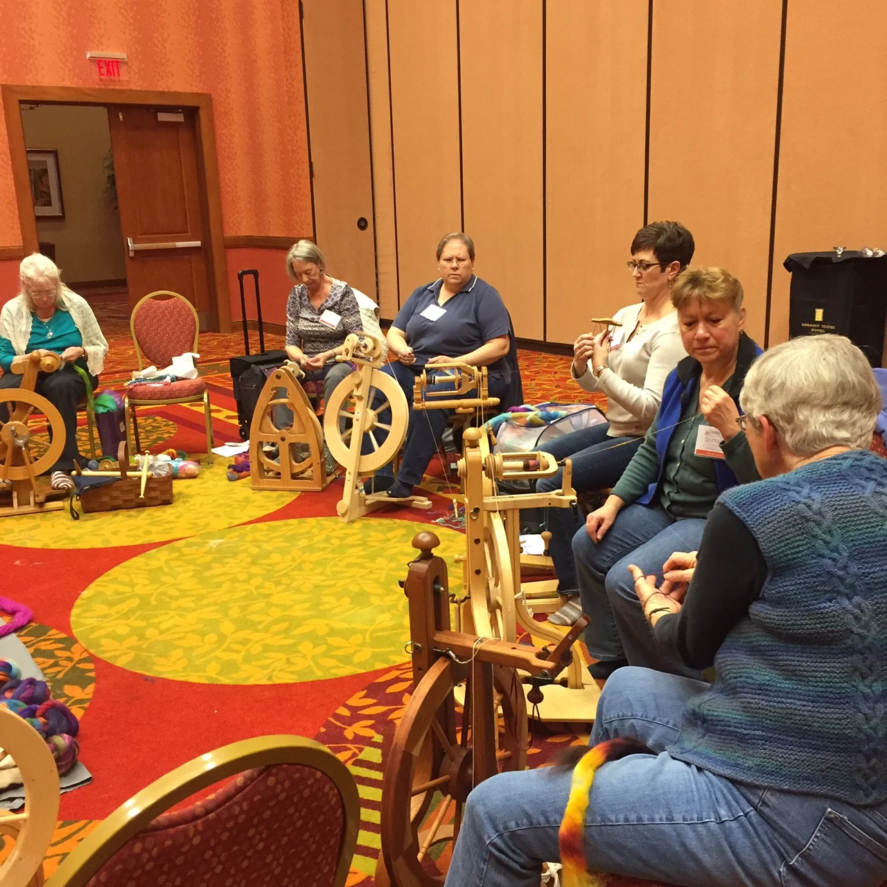 Maggie Casey, lower right, demonstrating Andean plying.