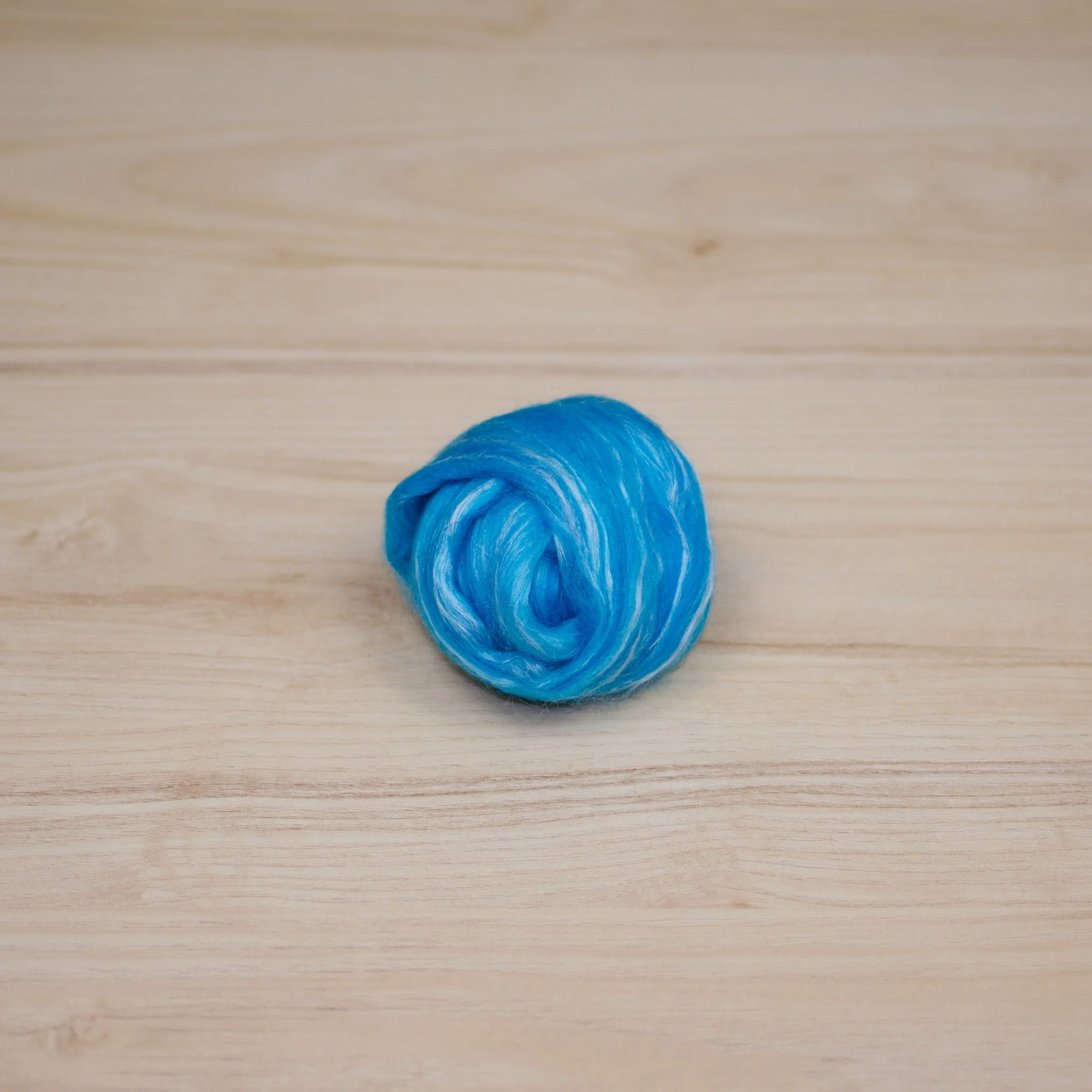 This is Merino/silk top from DM Fibers. It’s labeled top on their website. Isn’t it pretty?
