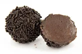 Normal
0
false
false
false
EN-US
X-NONE
X-NONE
Cointreau Smooth and buttery dark chocolate centre drenched in enticing Cointreau with a hint of sweet orange. Coated in fine dark chocolate and heavenly Belgian vermicelli sprinkles.
/* Style Definitions */
table.MsoNormalTable
{mso-style-name:"Table Normal";
mso-tstyle-rowband-size:0;
mso-tstyle-colband-size:0;
mso-style-noshow:yes;
mso-style-priority:99;
mso-style-qformat:yes;
mso-style-parent:"";
mso-padding-alt:0in 5.4pt 0in 5.4pt;
mso-para-margin-top:0in;
mso-para-margin-right:0in;
mso-para-margin-bottom:10.0pt;
mso-para-margin-left:0in;
line-height:115%;
mso-pagination:widow-orphan;
font-size:11.0pt;
font-family:"Calibri","sans-serif";
mso-ascii-font-family:Calibri;
mso-ascii-theme-font:minor-latin;
mso-fareast-font-family:"Times New Roman";
mso-fareast-theme-font:minor-fareast;
mso-hansi-font-family:Calibri;
mso-hansi-theme-font:minor-latin;
mso-bidi-font-family:"Times New Roman";
mso-bidi-theme-font:minor-bidi;}