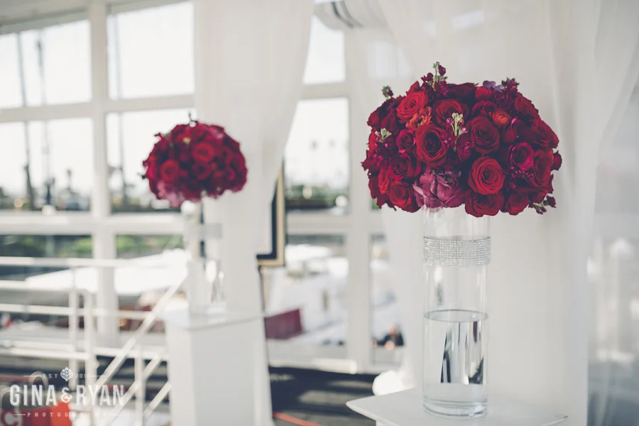 Natalie and Brian were recently married on a sunny Saturday in April.  The ceremony was held at boat in Marian Del Ray.  Their colors were red and ivory with silver accents. Here are some beautiful images provided by Gina and Ryan&nbs…