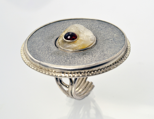 Sterling silver ring with washer, a piece of quartz Jeff found on the Rail Trail set with a garnet.