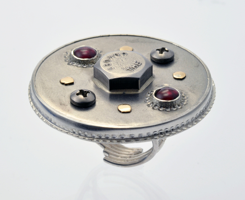 Sterling silver ring with stainless steel, 14 karat yellow gold and garnet