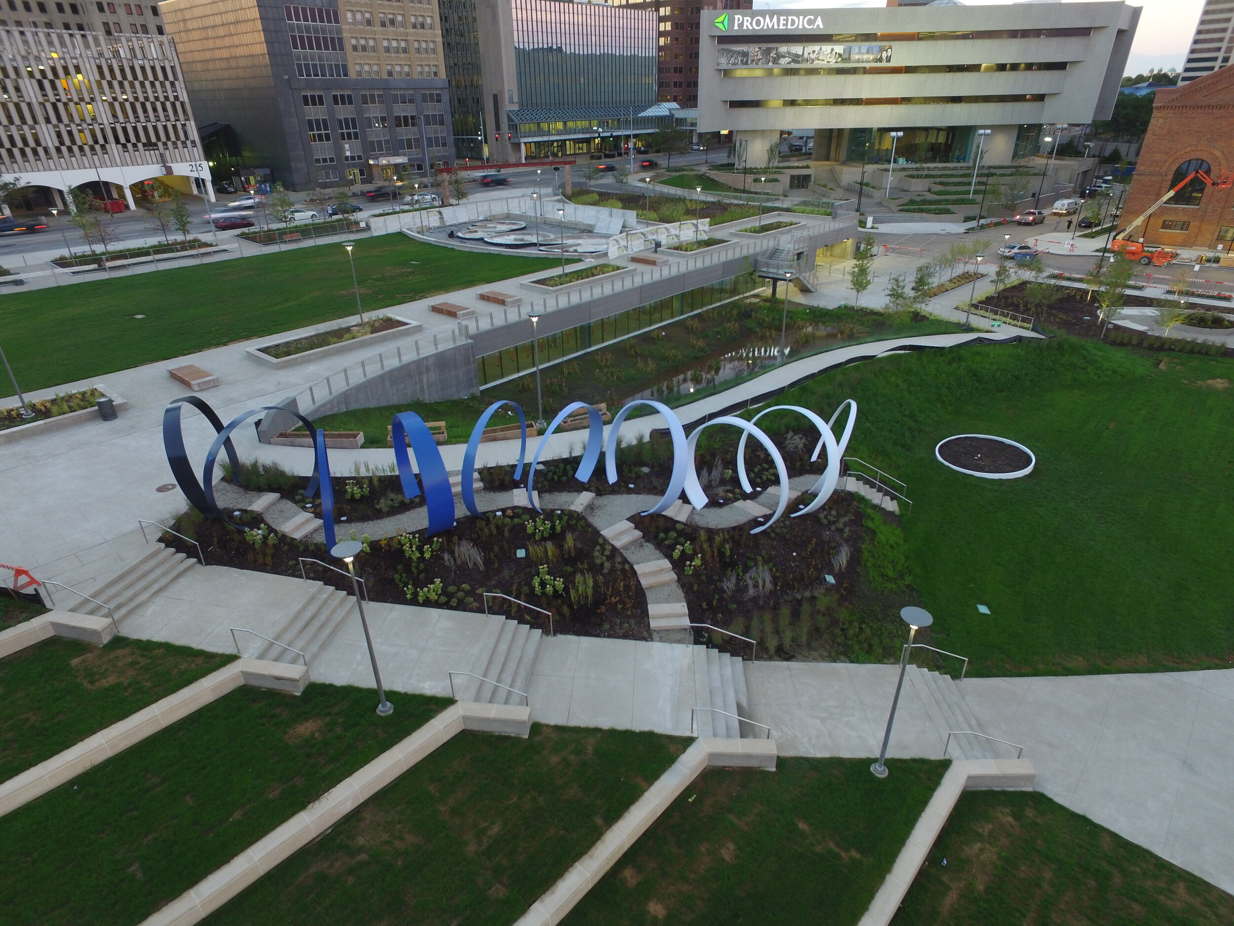  Echo stands as a reverberating reminder of The Edison Steam Plant's early role in energy production for Toledo.   Once a towering piece of metal sitting atop the steam plant, Echo’s eleven rings now integrate into the landscape creating a pathway th