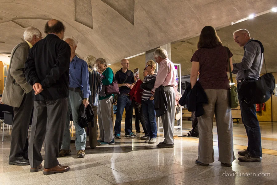 members of the public gather in the lobby before the debate