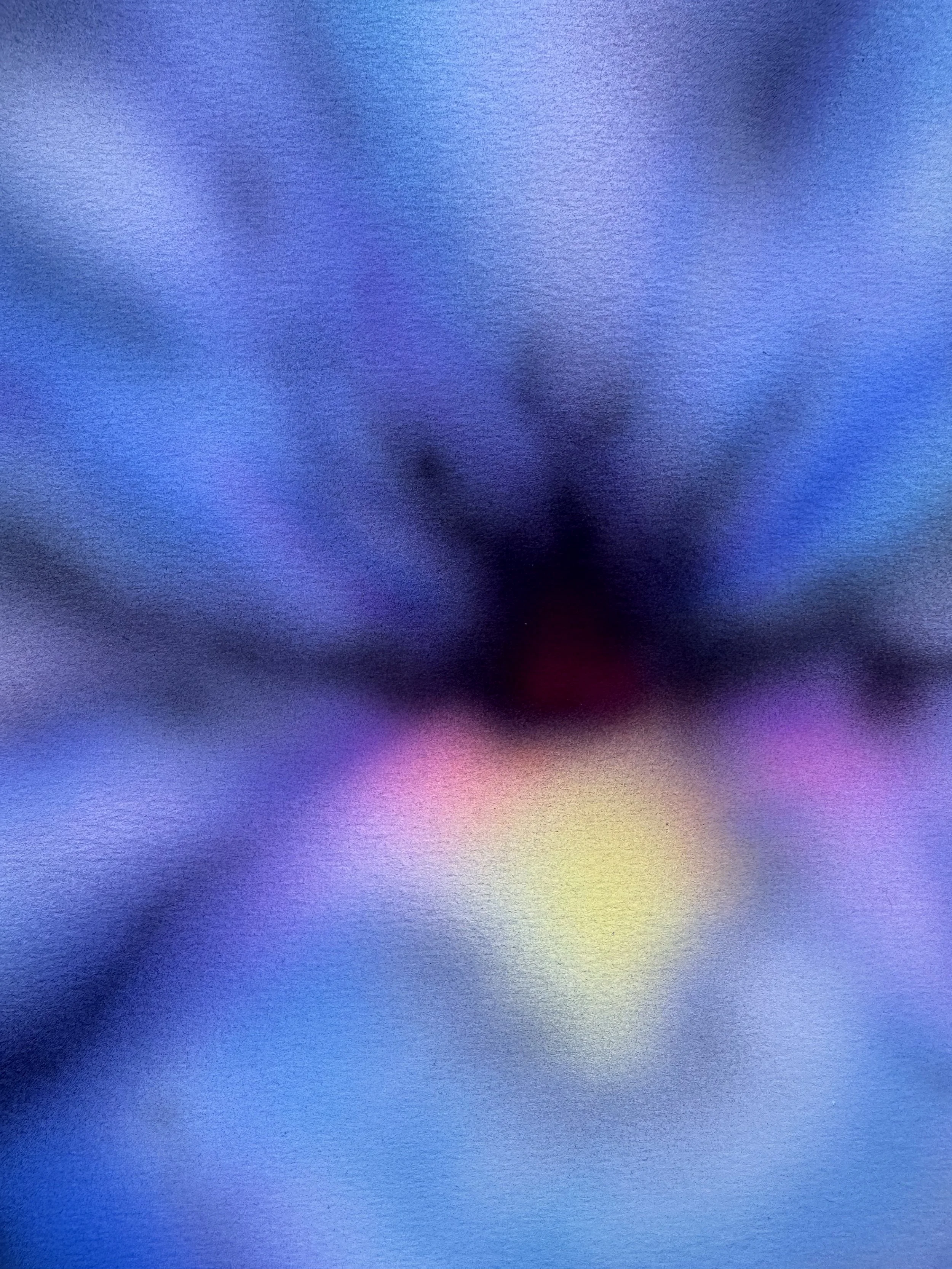 Abstract background with soft blurred colors including blue, purple, yellow, and pink.