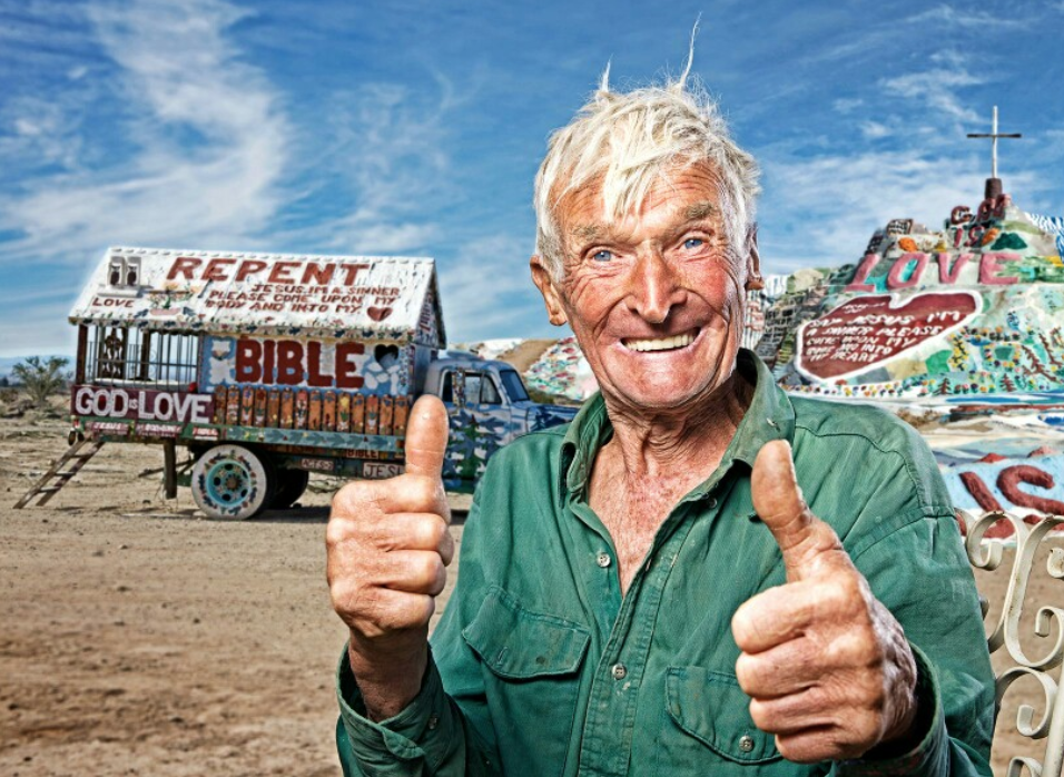 Leonard Knight the creator of Salvation Army stands in front of his masterpiece