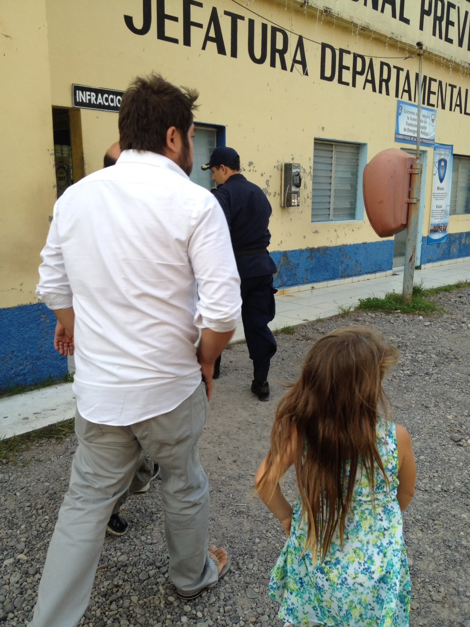 Javier Mendoza with his daughter on a tour of the Honduran National Police station in La Ceiba Honduras