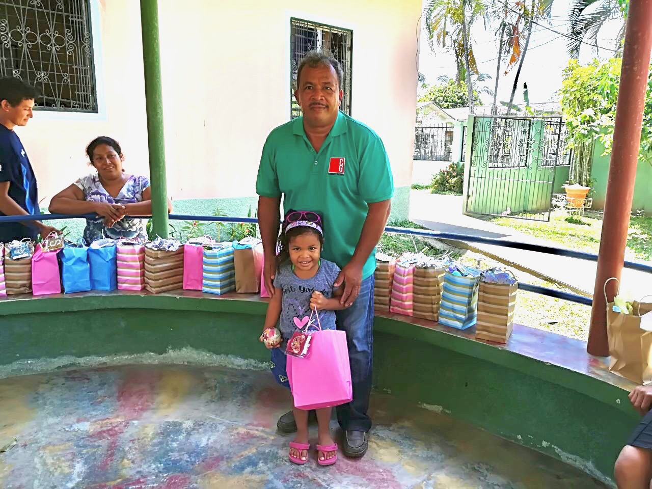 Connect Global National Director in Honduras, Jorge Amador, sharing Easter baskets with the Kids from Little Lambs Refuge in La Masica, Honduras is seen here with his daughter, Allison.