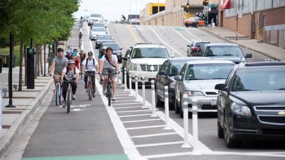 Looks like cars had to choose between a lane of traffic or street parking - but I know my kid would feel safer on this. If this loss of a lane of traffic makes you unhappy - you're not doing good by the environment (plus: don't you want us cyclists out of your car lane?)
