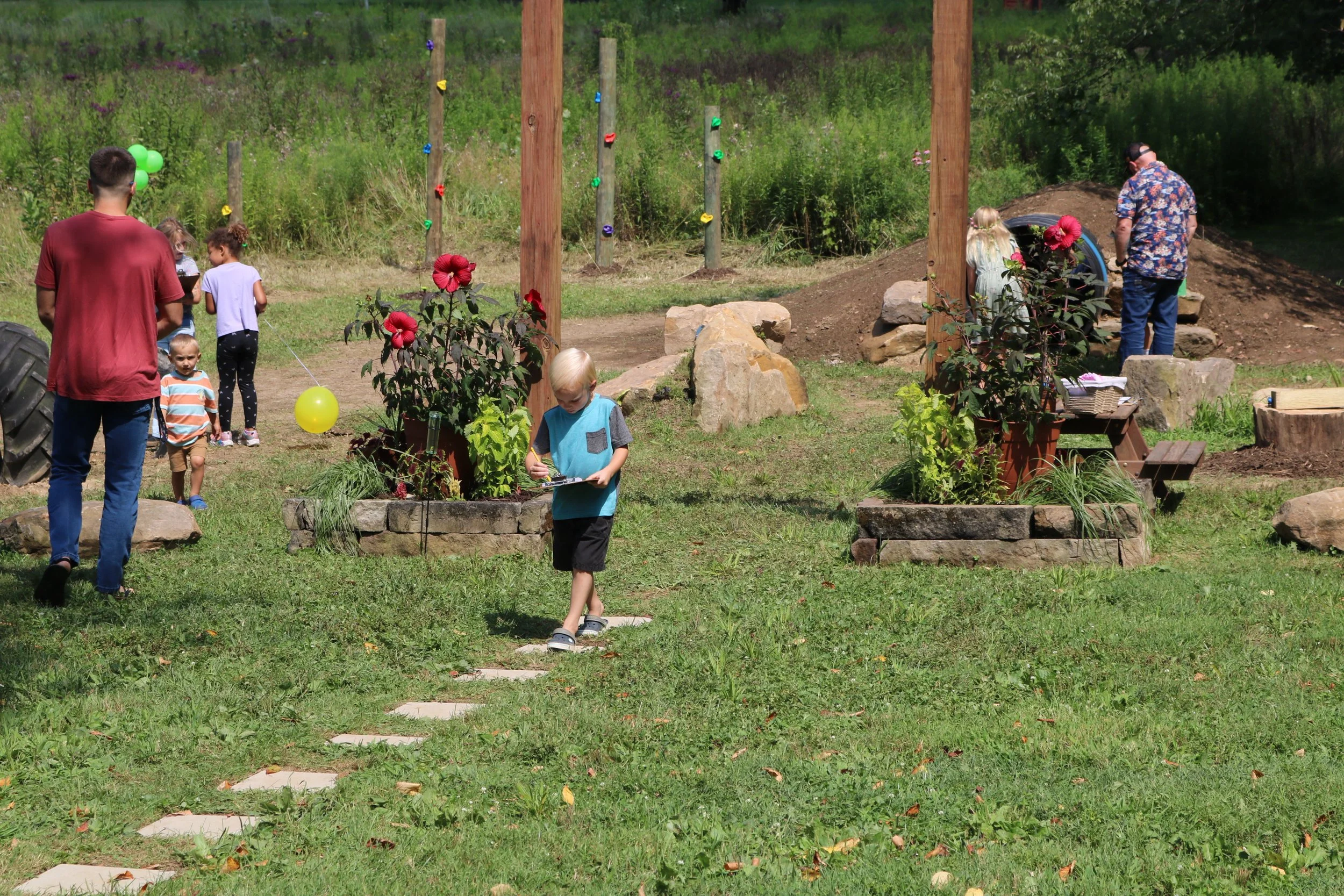 Parents and children explore the new playground