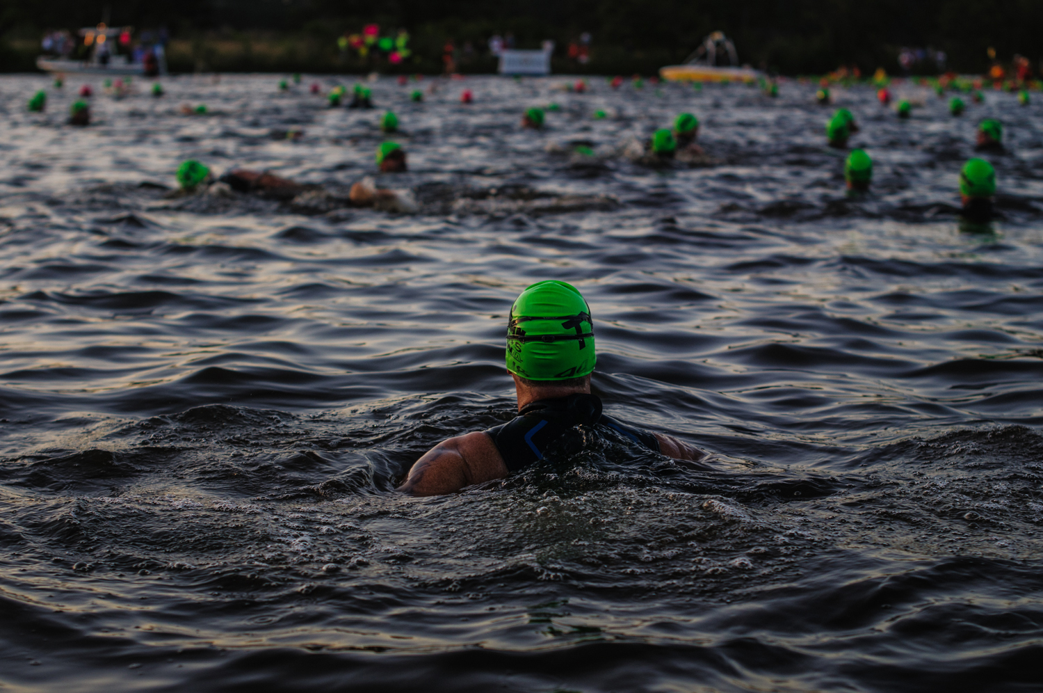  Prior to the start, the athletes warmed up in the wet-suit legal 68 ° water.  