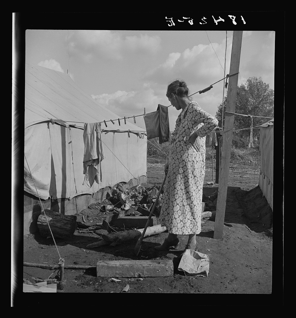  Women in auto camp for migrant citrus workers. Tulare County, California. 
