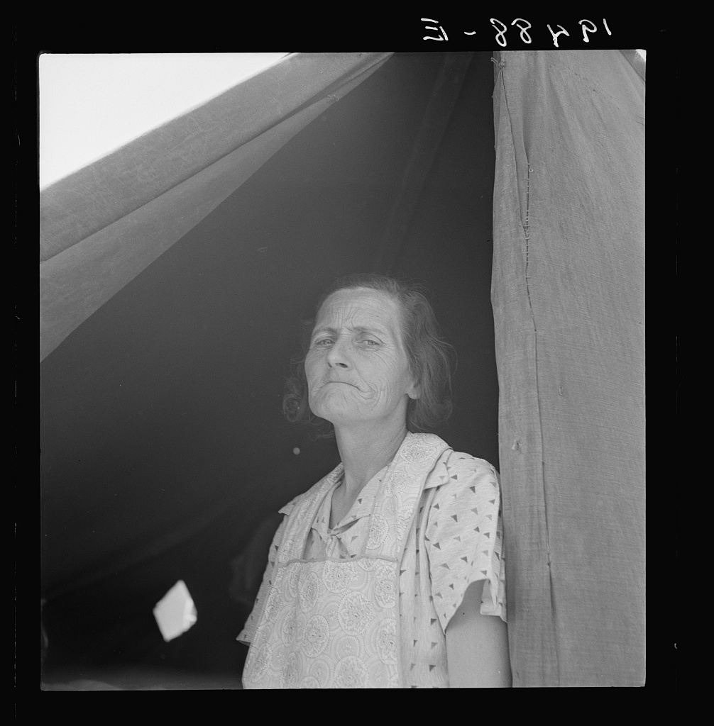  Migrant woman from Arkansas living in contractor's camp near Westley, California. She would prefer to live in a government camp, but the contractor system prevents, because of control over allocations of work. 
