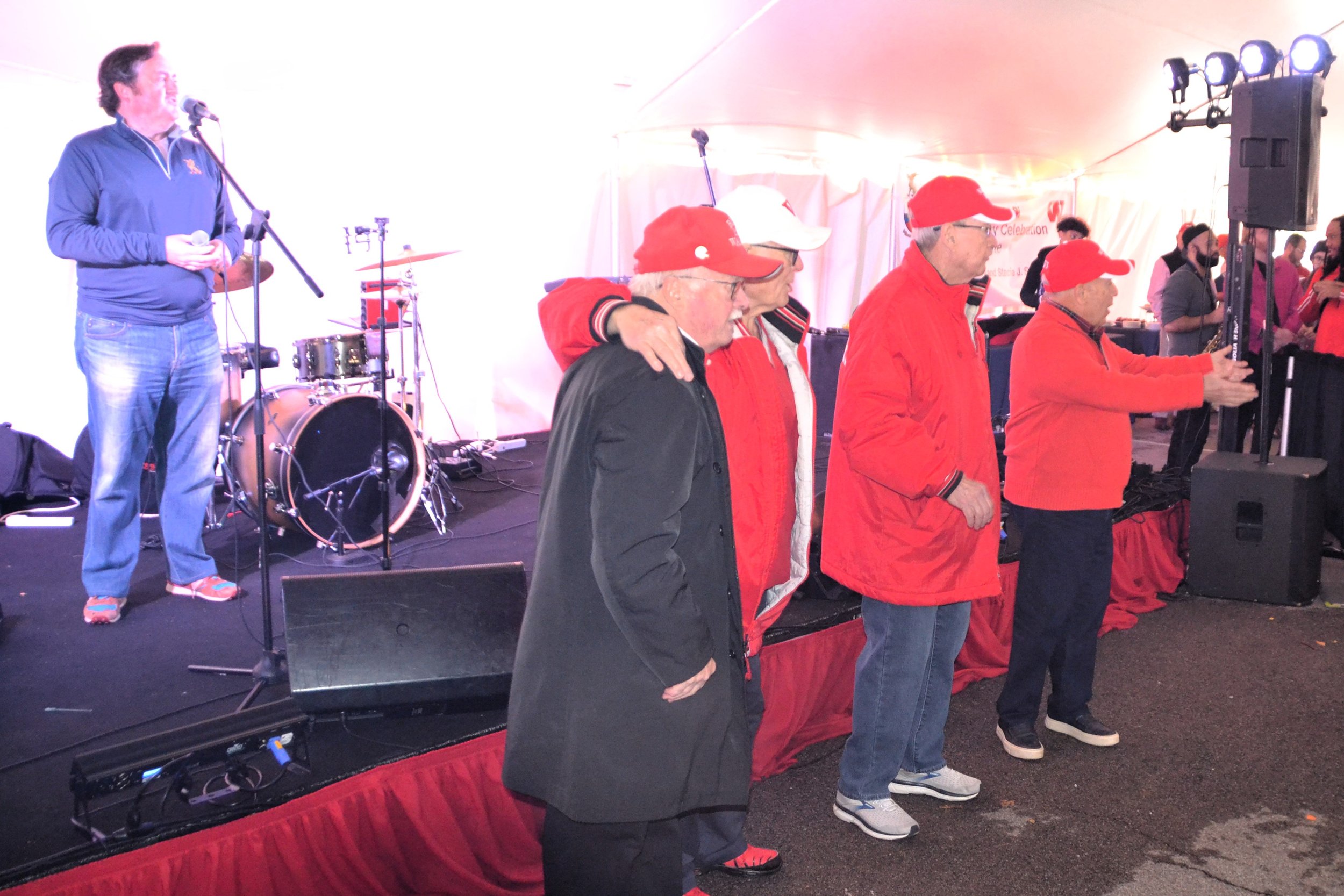  Squier Neal '66, Charlie Bell '66, Cal Black '66, and John Flanagan '66 take the stage to lead the crowd in singing Old Wabash. 