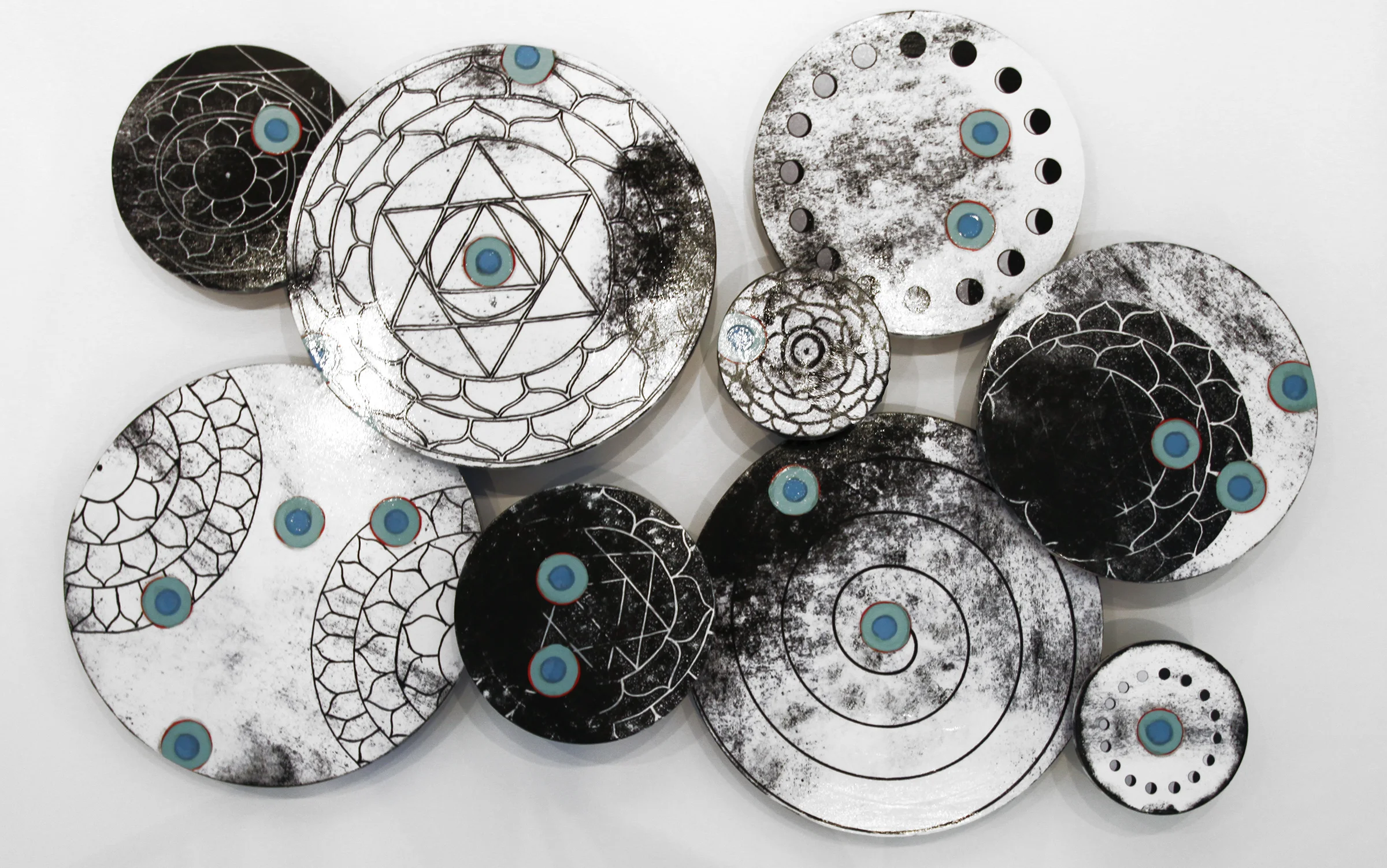 Laksmi Installation, 2016, Mixed Media on 9 panels, 20", 16", 12" and 8" variable depths from wall
