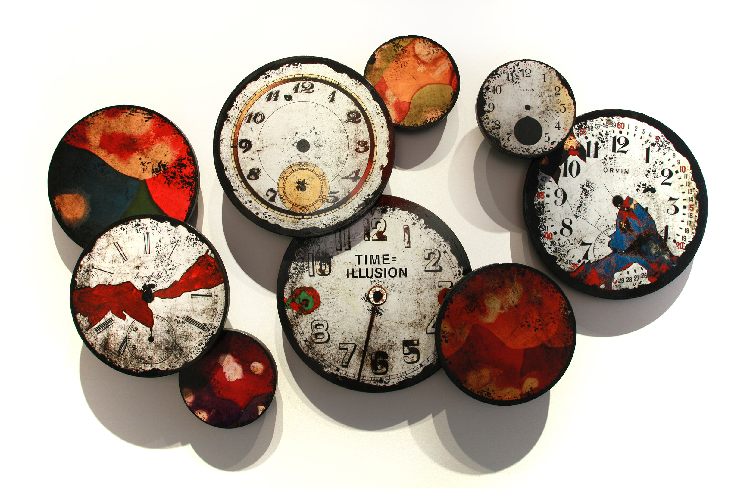 Time = Illusion Installation, Mixed Media on 9 panels sized between 10" - 20" in diameter. As pictured here the installation is 41" x 69.75", 2016