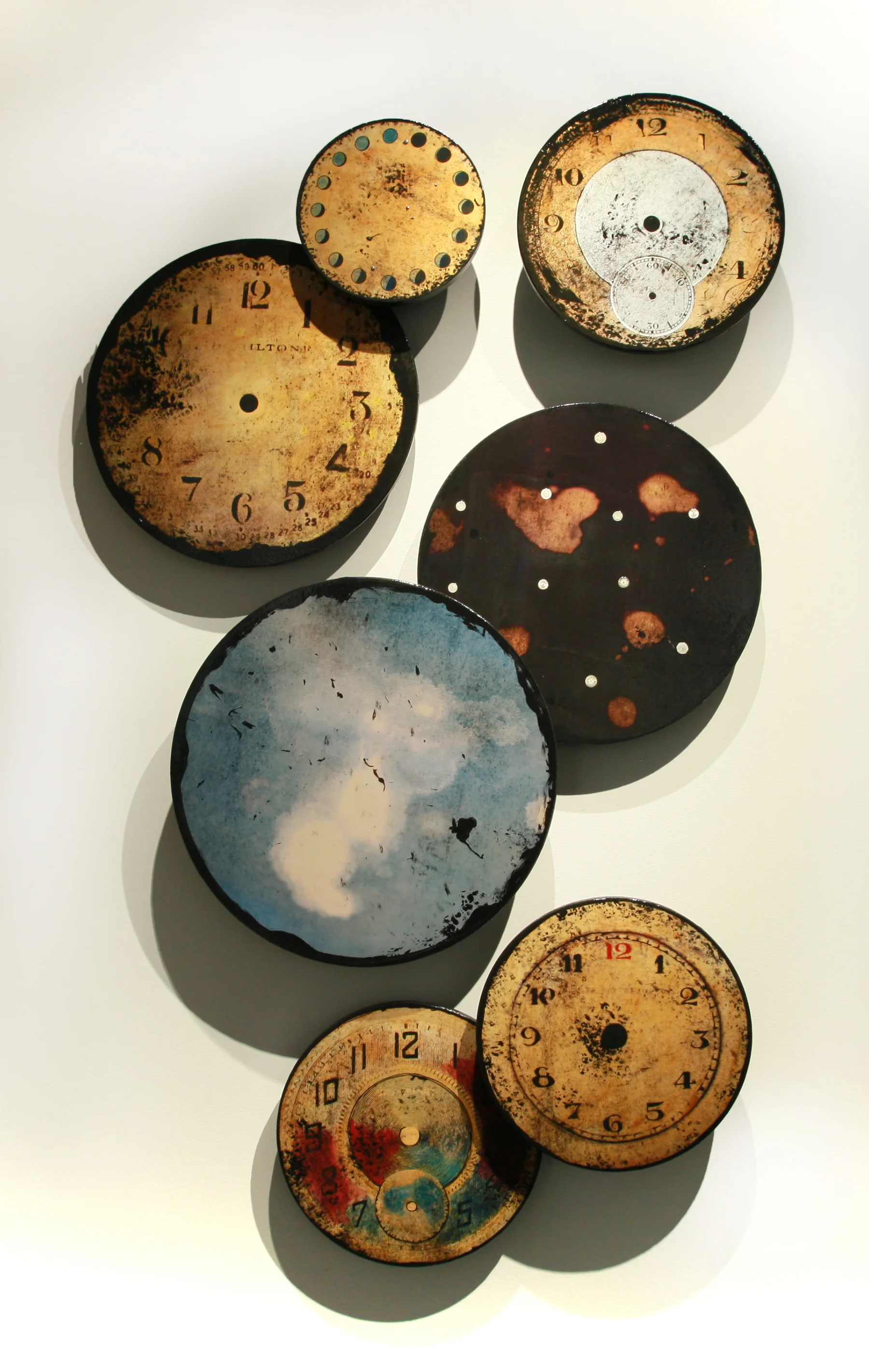 Time Changes Everything, Mixed Media on 7 panels sized between 10" - 20" in diameter. As pictured here the installation is 62.25" x 38", 2016