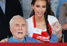 Here's Kim doing charity work/giving an old man an erection.