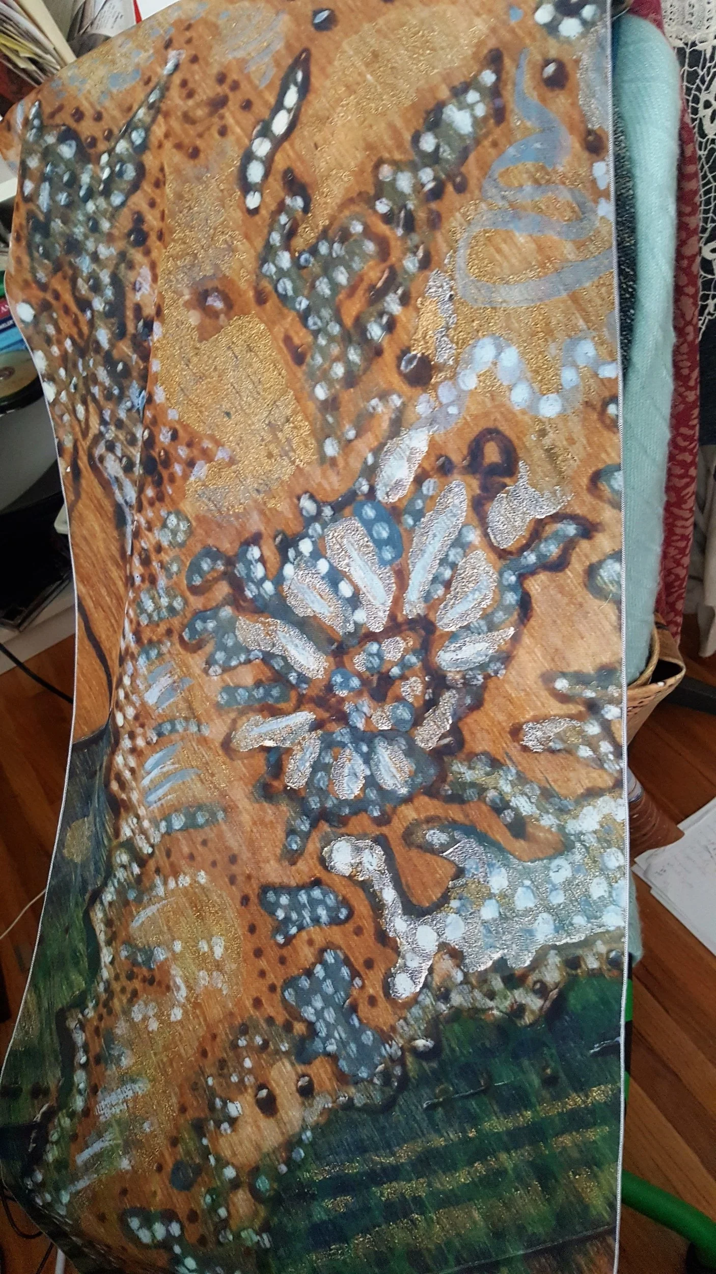 This is a poly chiffon scarf. The fabric is actually made in Canada and printed here as well, so that's pretty awesome. The painting is a seahorse, it's cropped pretty tight which gives it an abstract effect.