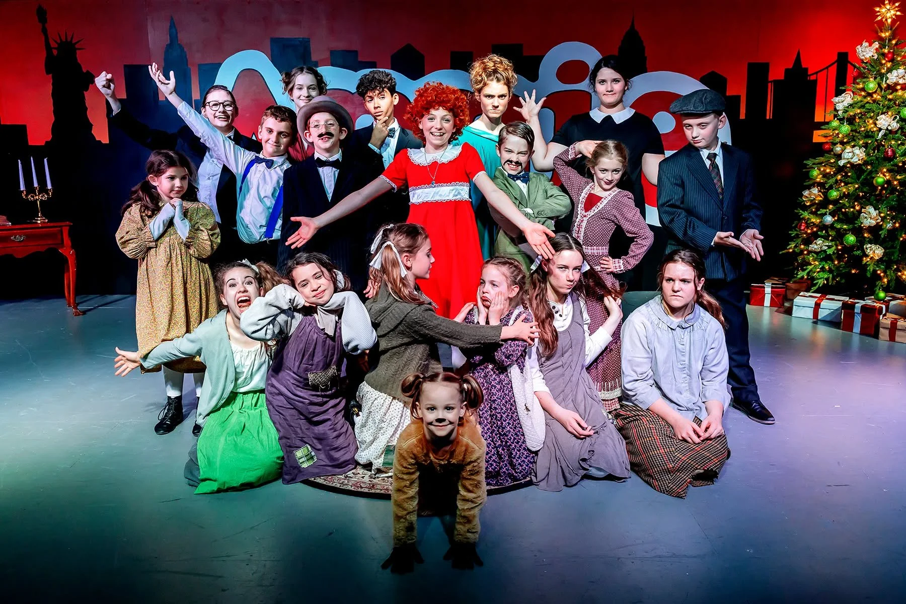 A cast photo from a homeschool theater production of Annie by Anderlin Arts.