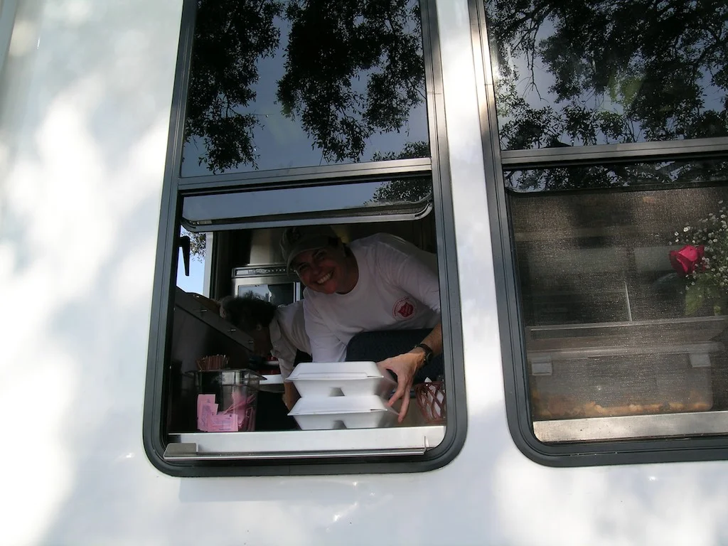 Felber delivering hot meals with the Salvation Army after Hurrivane Ivan