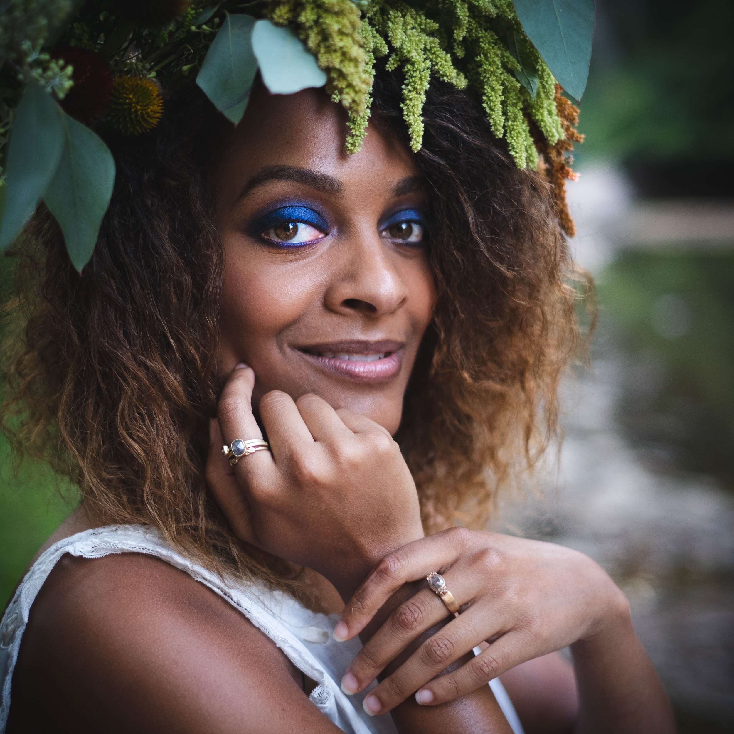 woman with naturally curly ethnic hair wearing nature crown and Jennifer Dawes Jewelry