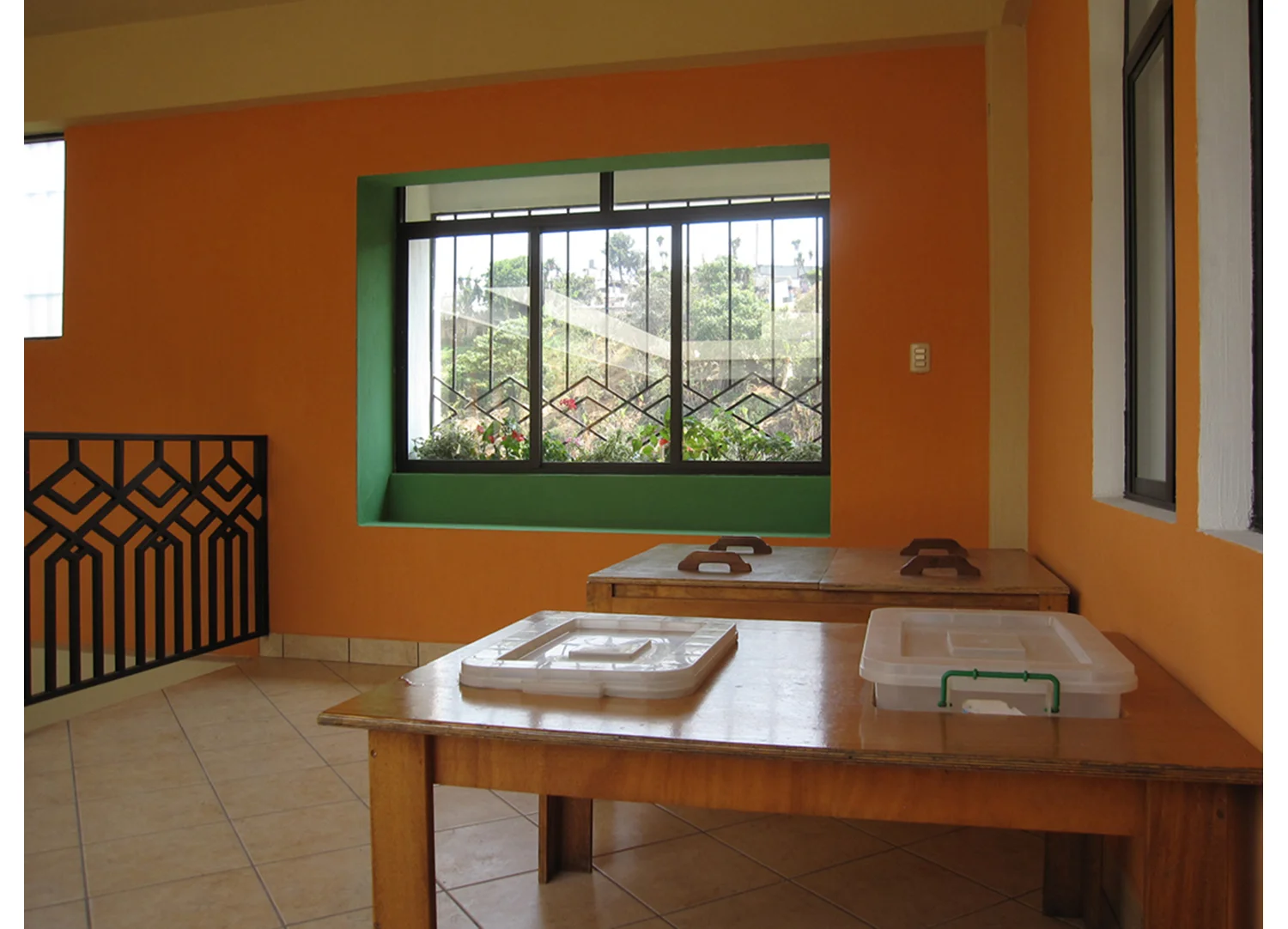  Window security bars (typical for the region) and interior railings are designed to be fanciful while ensuring the safety of the building's occupants and the security of its contents. The shapes in the bars are inspired by local hand-woven fabric pa