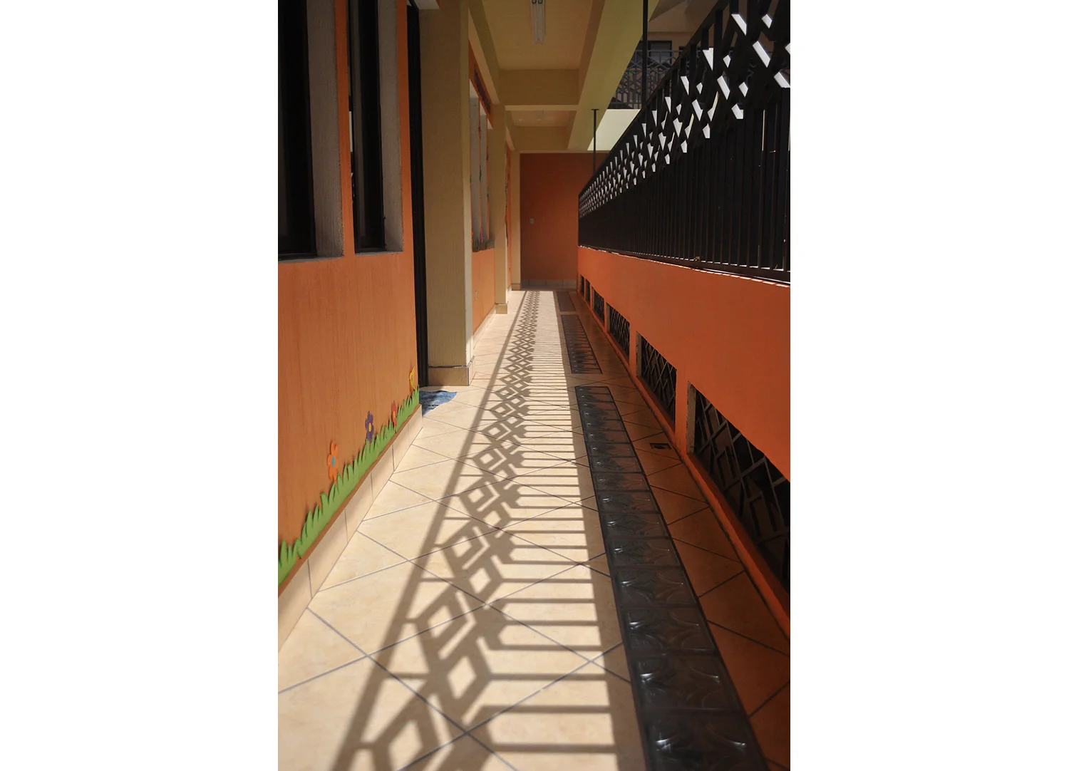  Window security bars (typical for the region) and interior railings are designed to be fanciful while ensuring the safety of the building's occupants and the security of its contents. The shapes in the bars are inspired by local hand-woven fabric pa