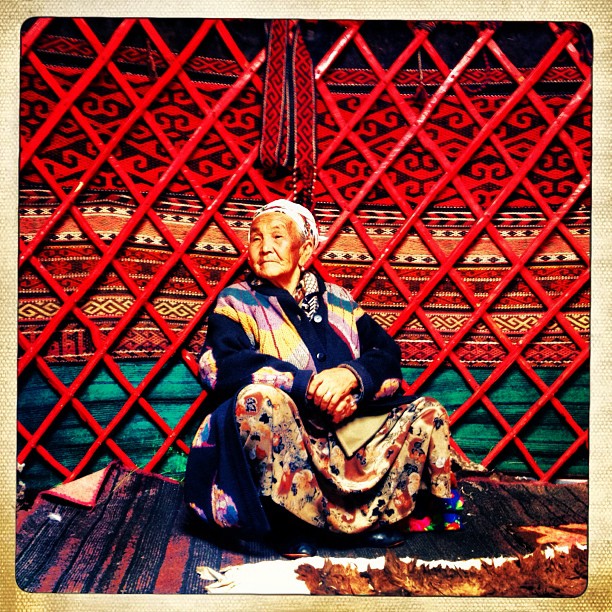 Ajay Nurza sits in her family&#8217;s yurt in a jailoo near Gulcha in Southern Kyrgyzstan. Rural residents will take their livestock to pasture land known as jailoo during the summer months for grazing before the winter comes. The yurt is made of se…