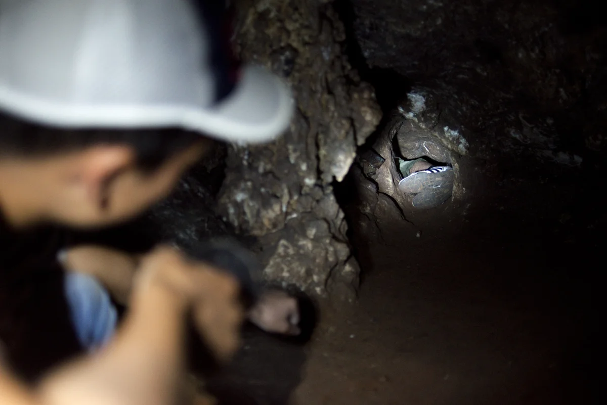 On Saturday, I met a few friends from Osh who drove over to Aravan. We spent the day in Talisman cave, a system located up in the mountains surrounding the town. This is Ulan, shining his headlamp on the feed of Ali as he squeezes through the next 4…