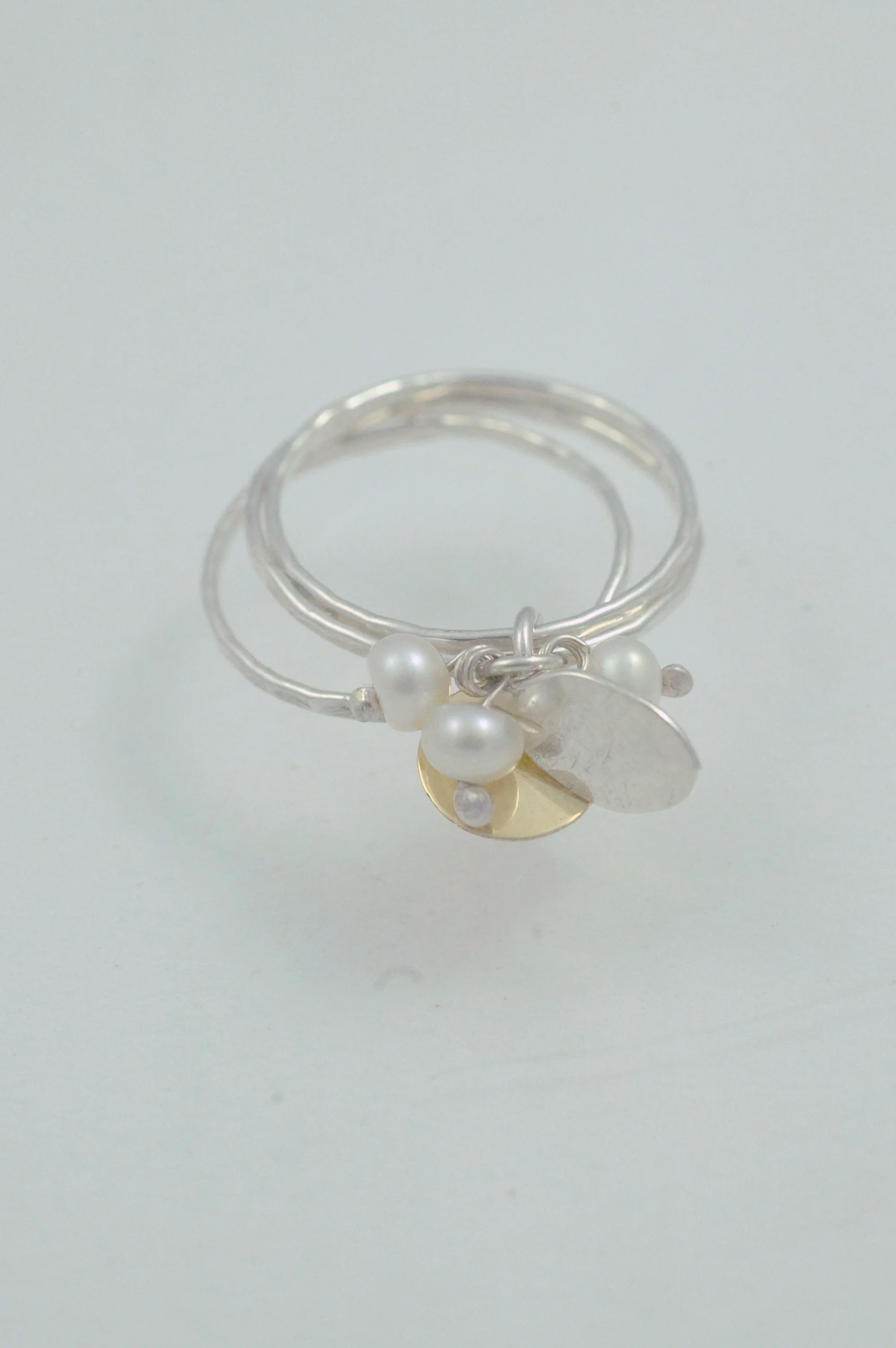 Triple ring with 9ct yellow gold dot and pearl.jpg