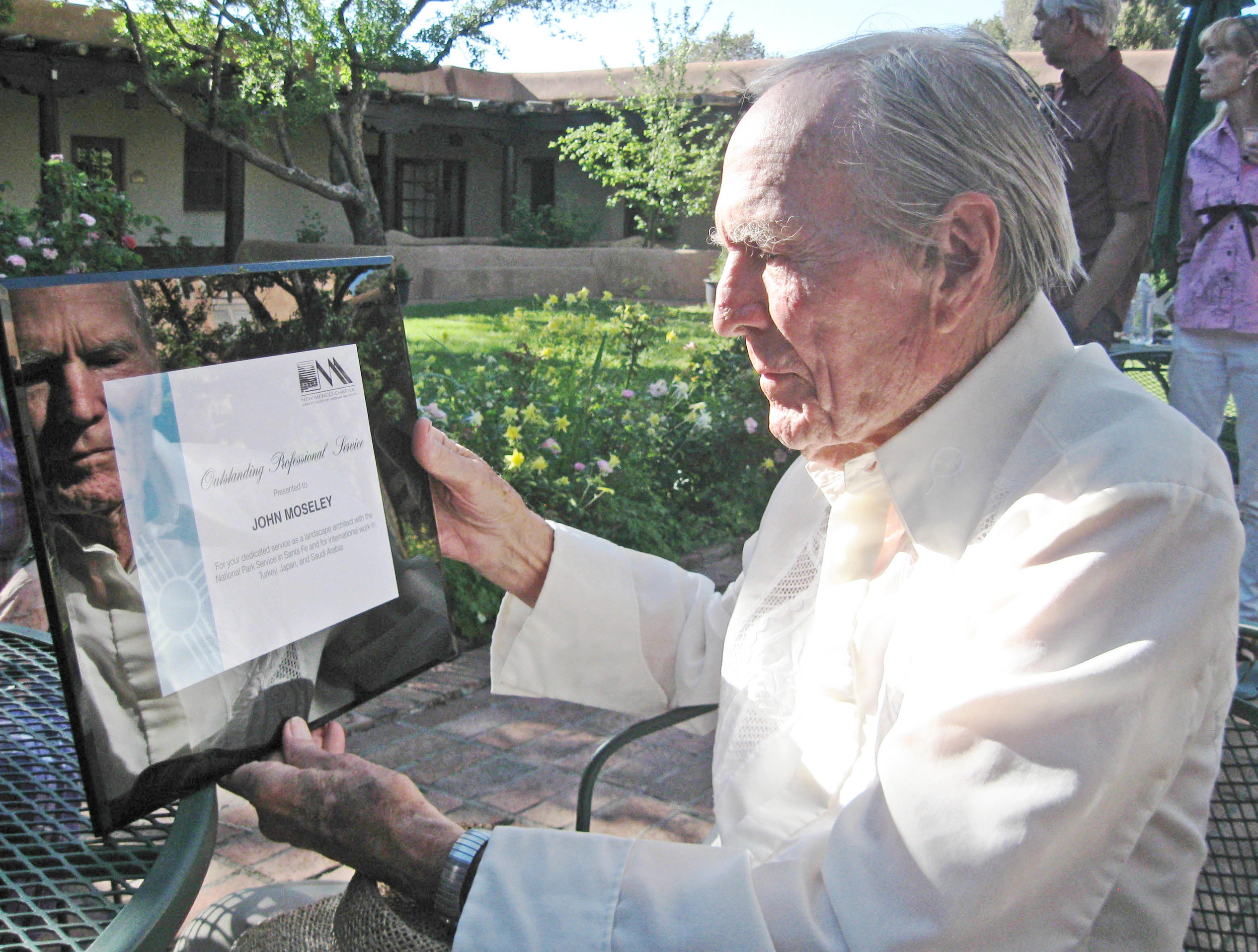 John accepts Outstanding Professional Service Award from NMASLA in 2012.