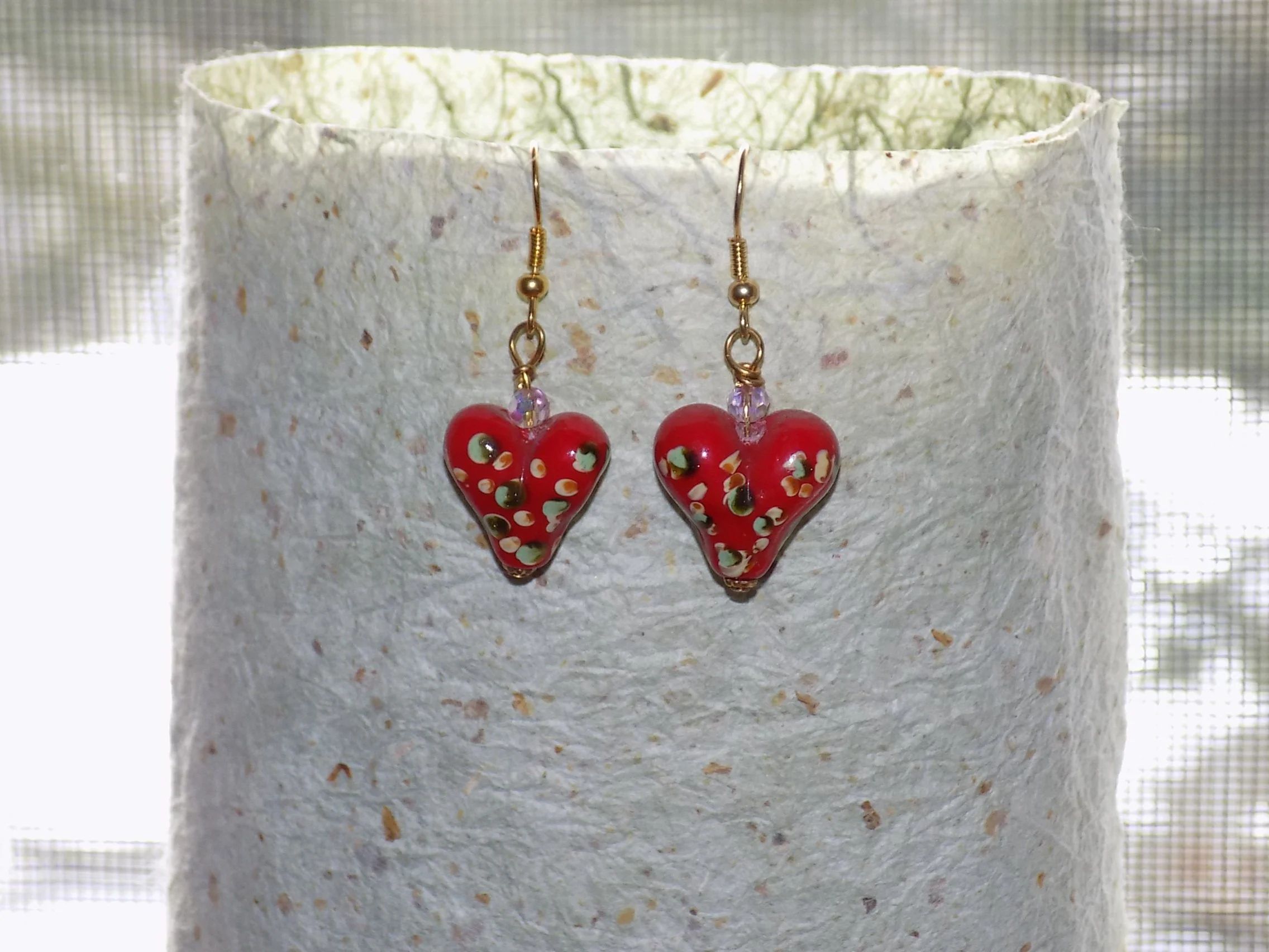 Gold tone porcelain heart earrings