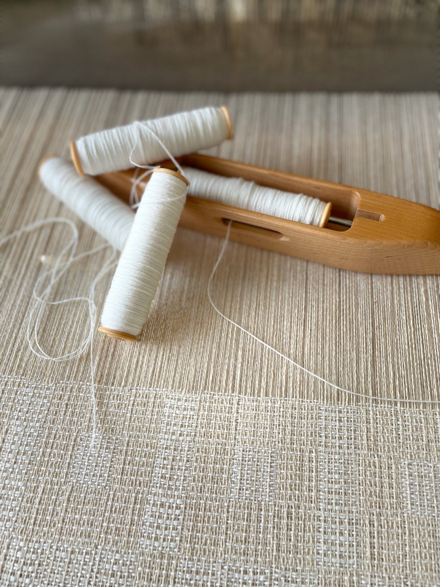 Shuttle and bobbins [organic cotton, hemp]