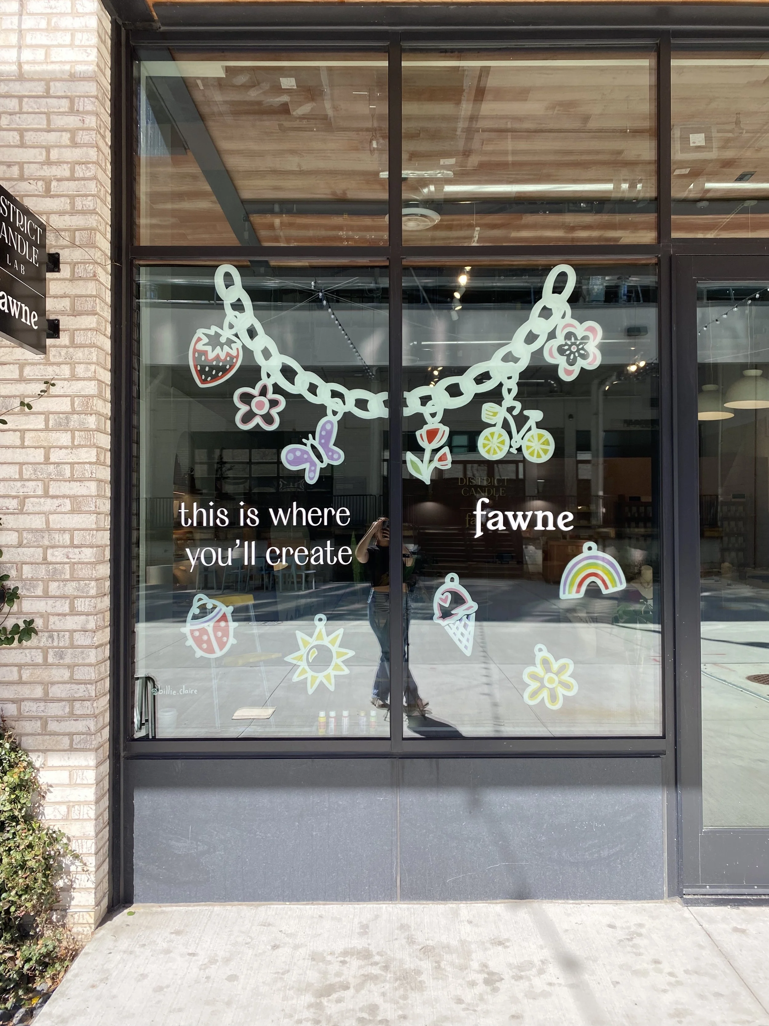 Custom window design for spring for Fawne / District Candle Lab at Union Market, March 2025.