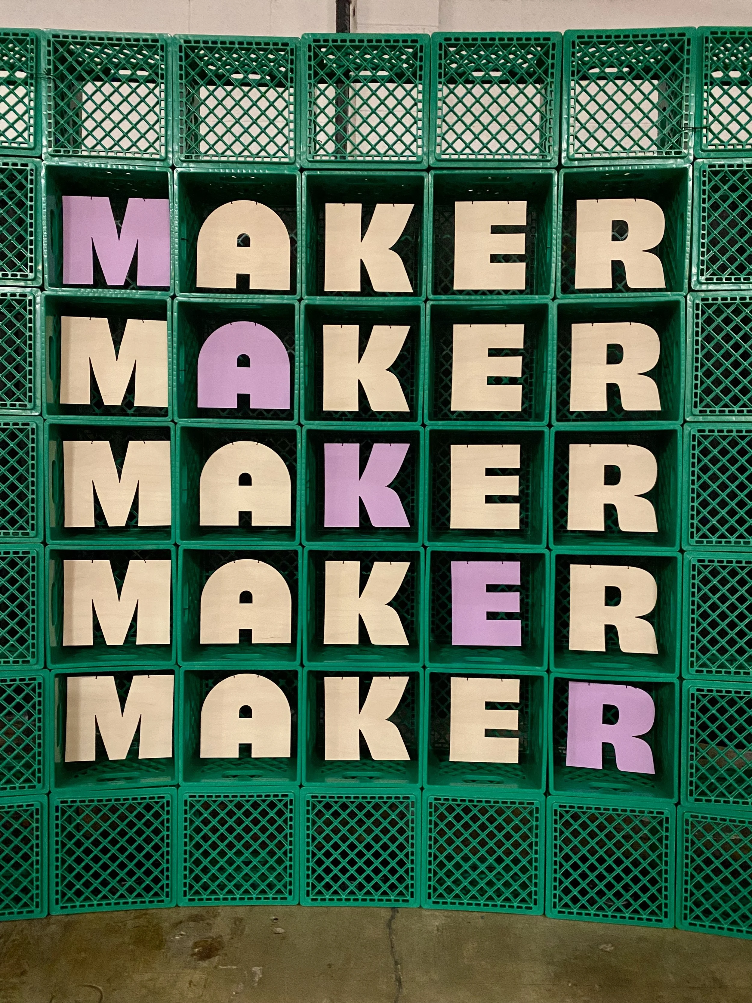 I laser cut, painted, and installed 25 MAKER letters inside stacked green crates to create a 'selfie station' at the event.