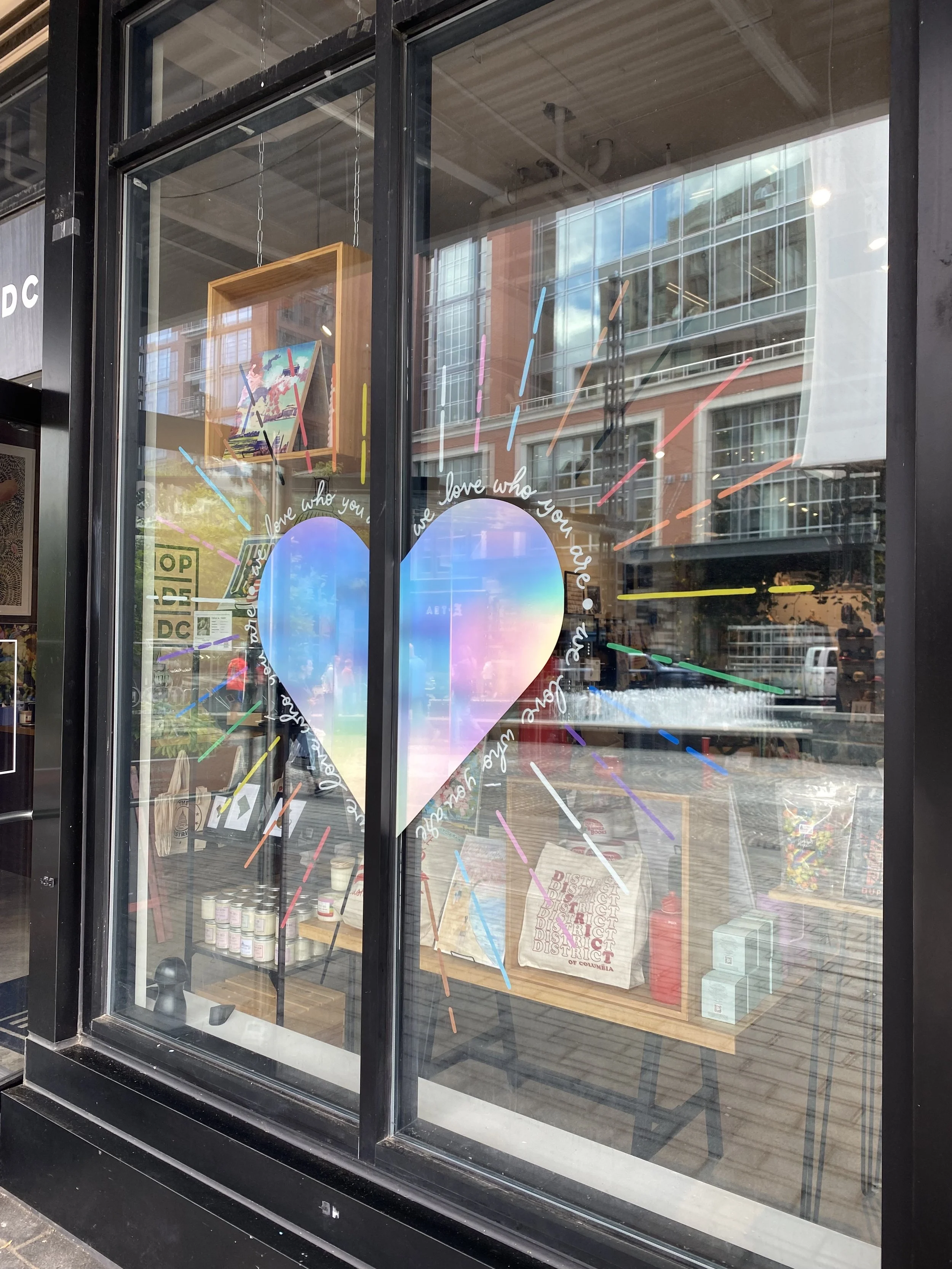 2025 Pride windows for Shop Made in DC Wharf (I painted the rainbow rays and designed the vinyl graphics).