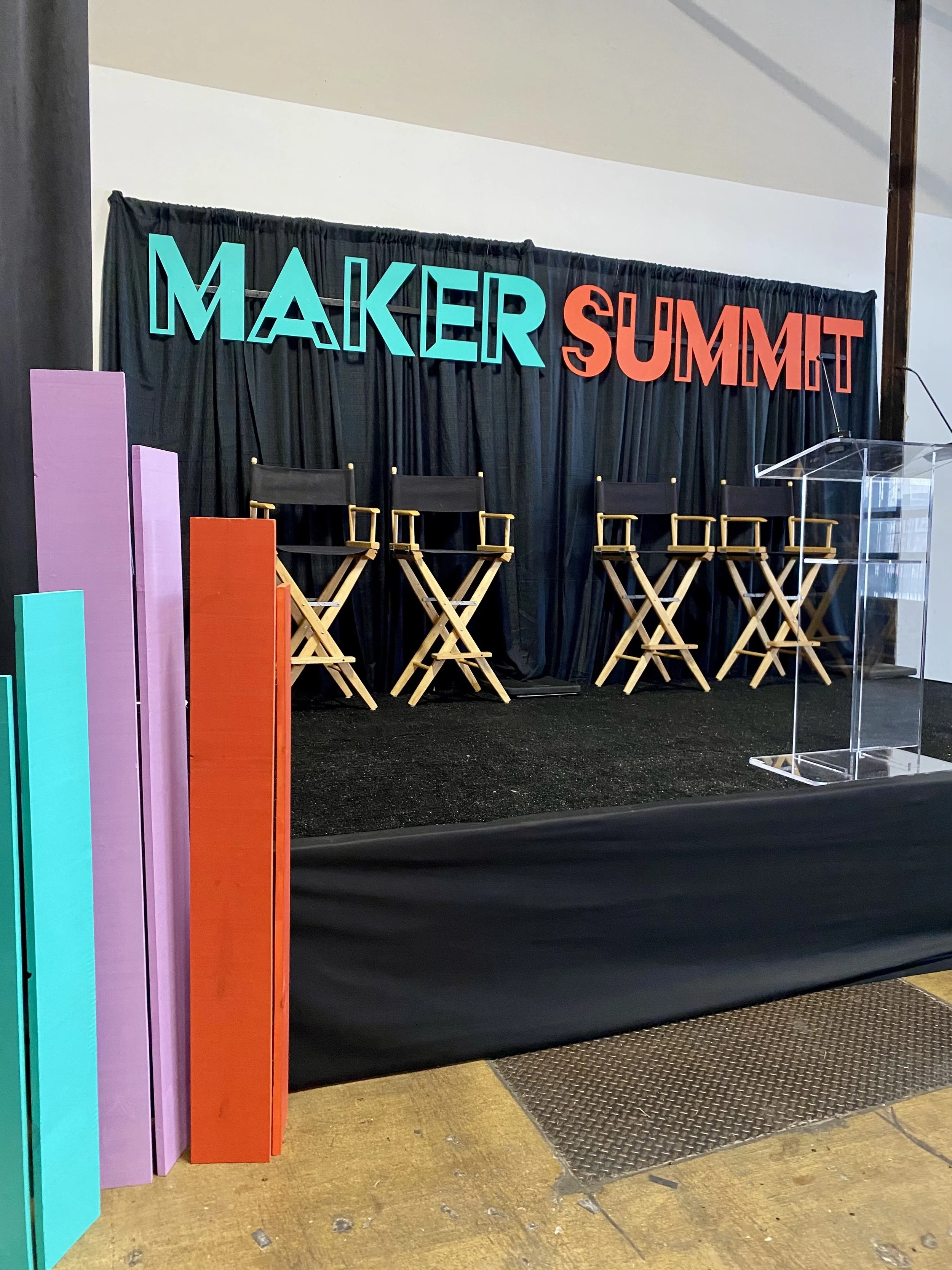 I laser cut, painted, built, and installed the stage title, and built and painted coordinating color blocks to frame the panelist stage. 