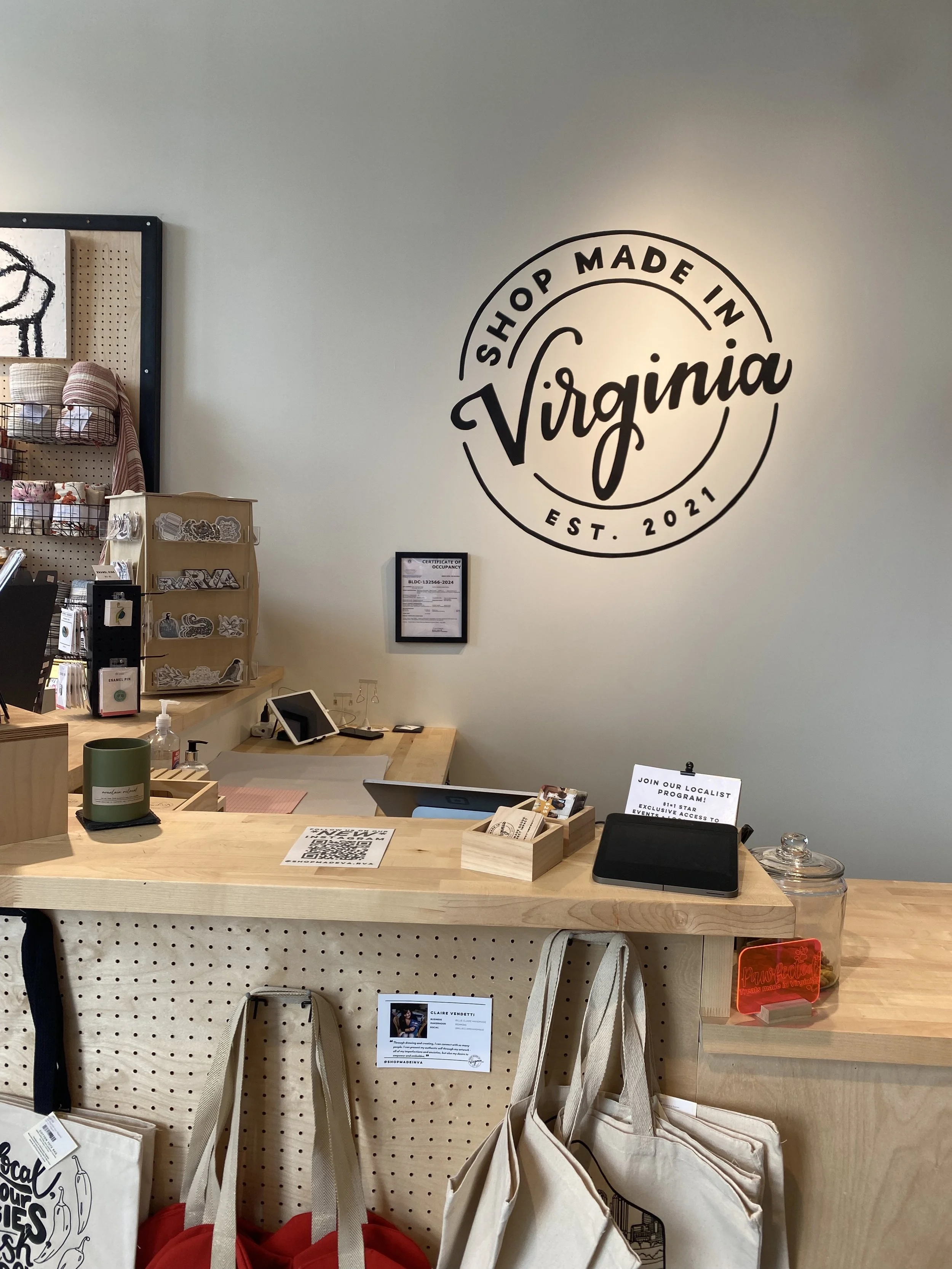 I painted the Shop Made in VA logo behind the retail counter for the opening of Shop Made in VA Richmond, Fall 2024.